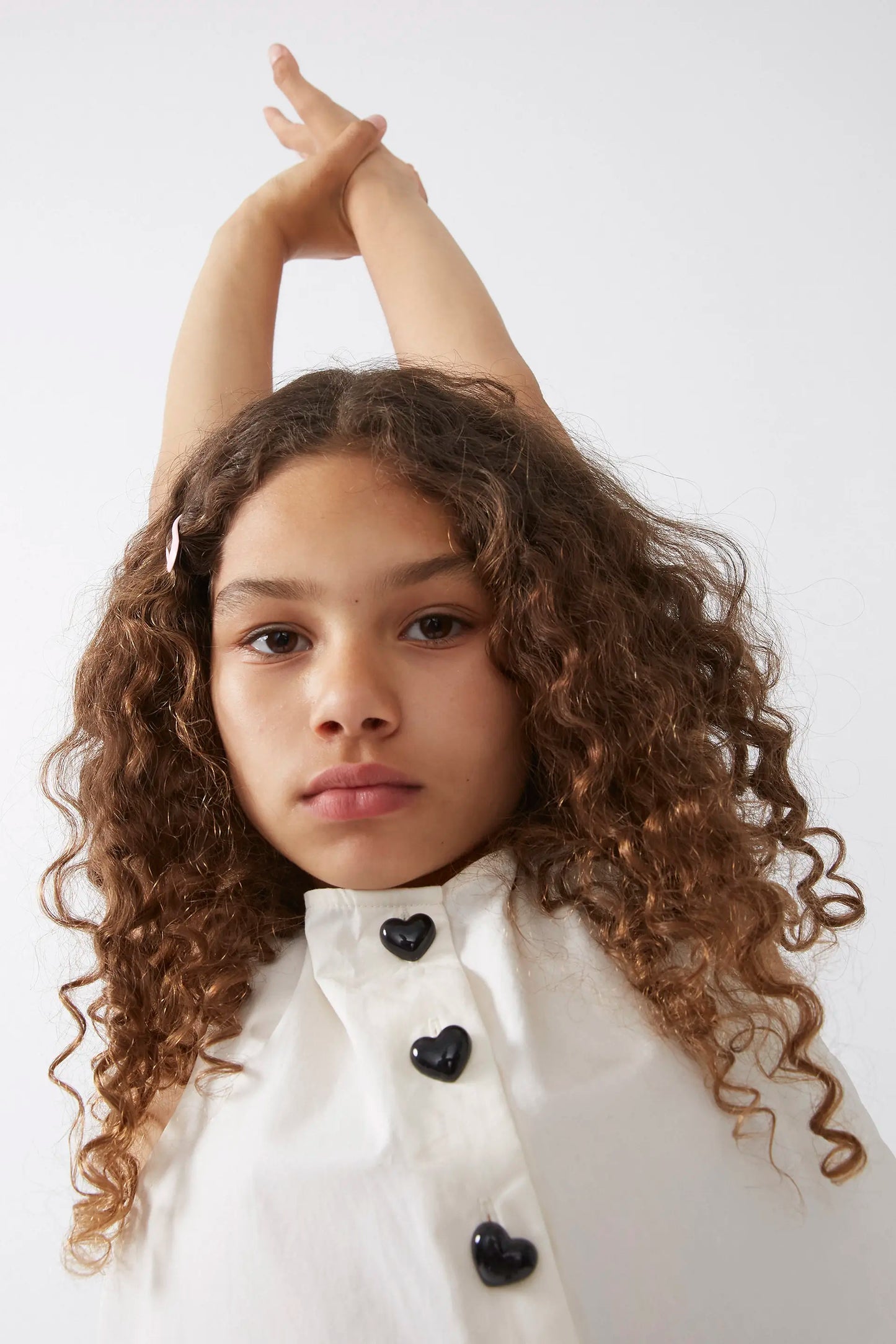 White buttoned girl's top
