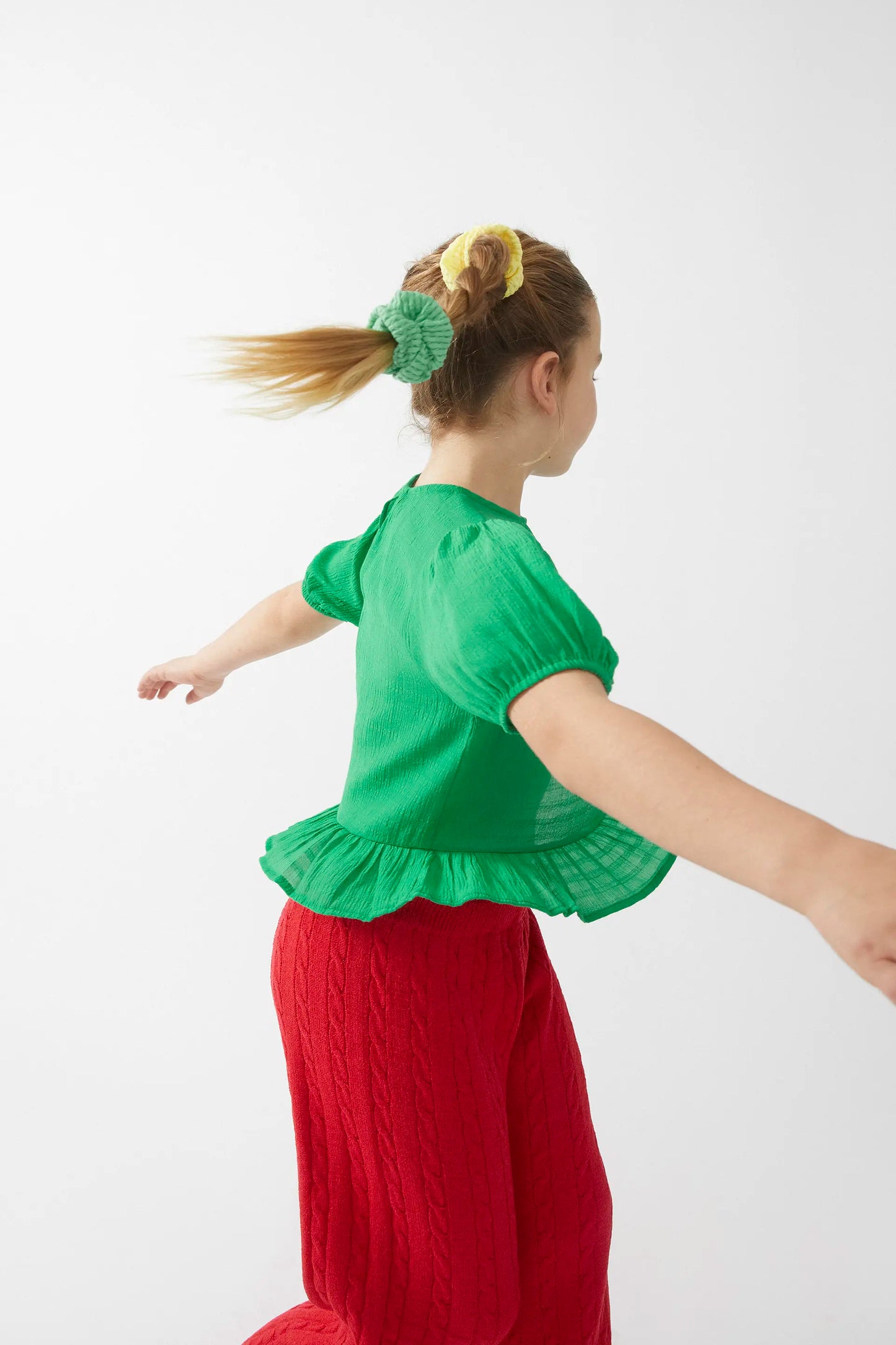 Green ruffled girl's top
