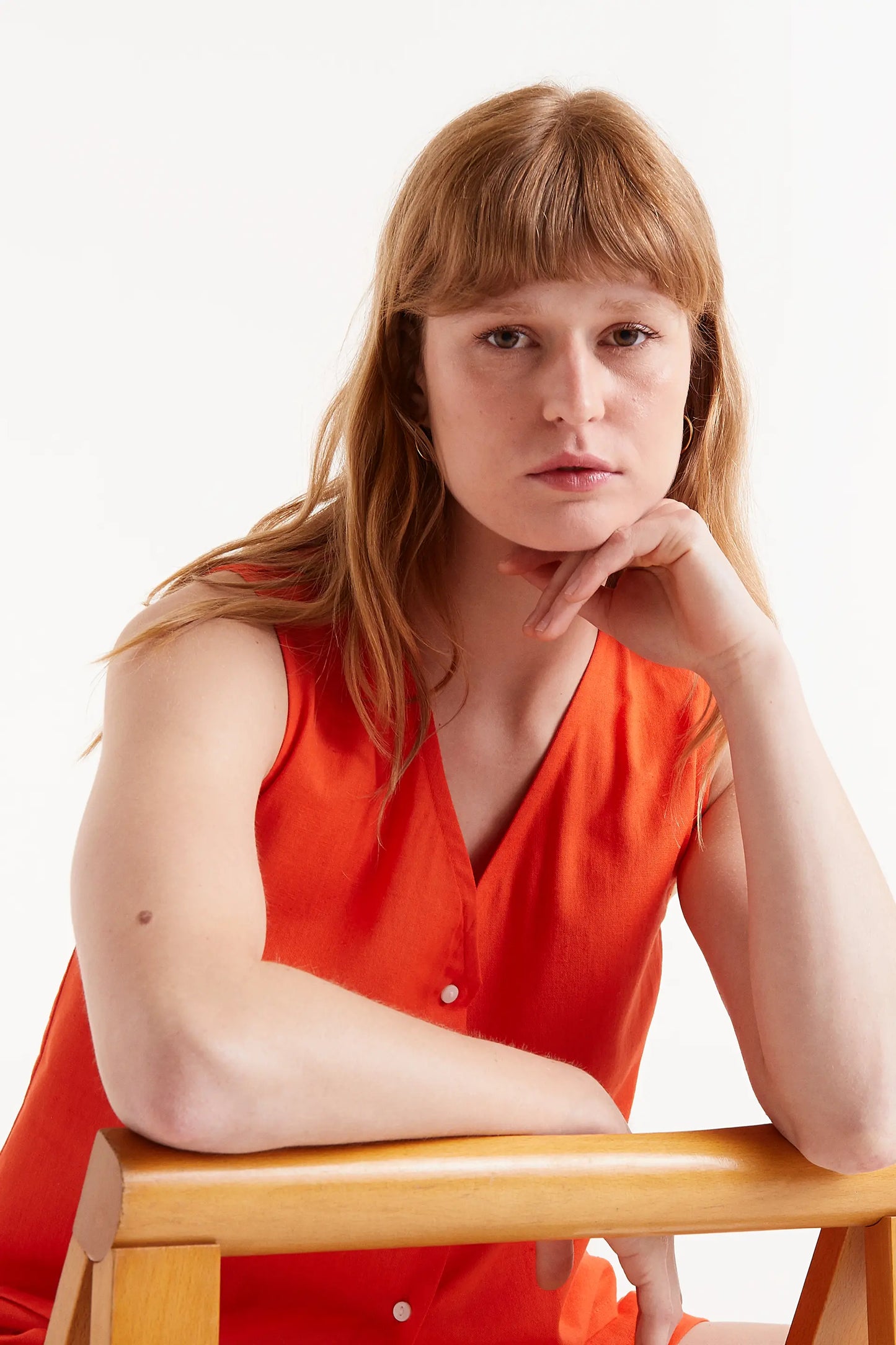 Orange button-down top