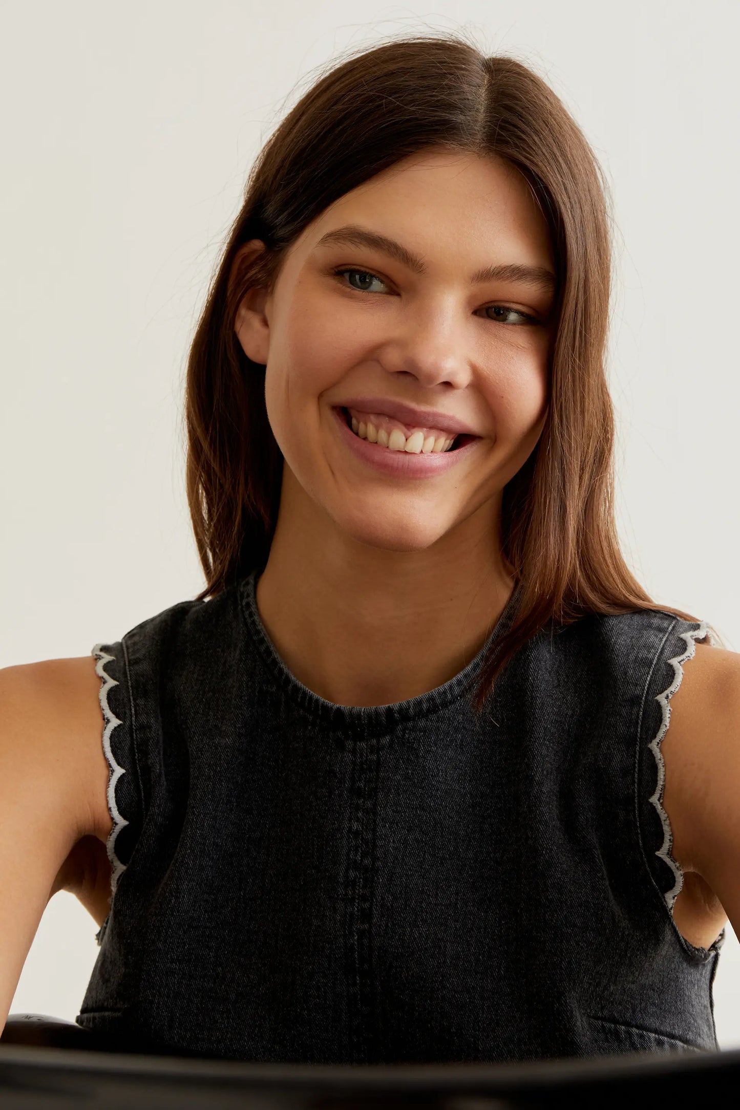 Black denim top with wavy details