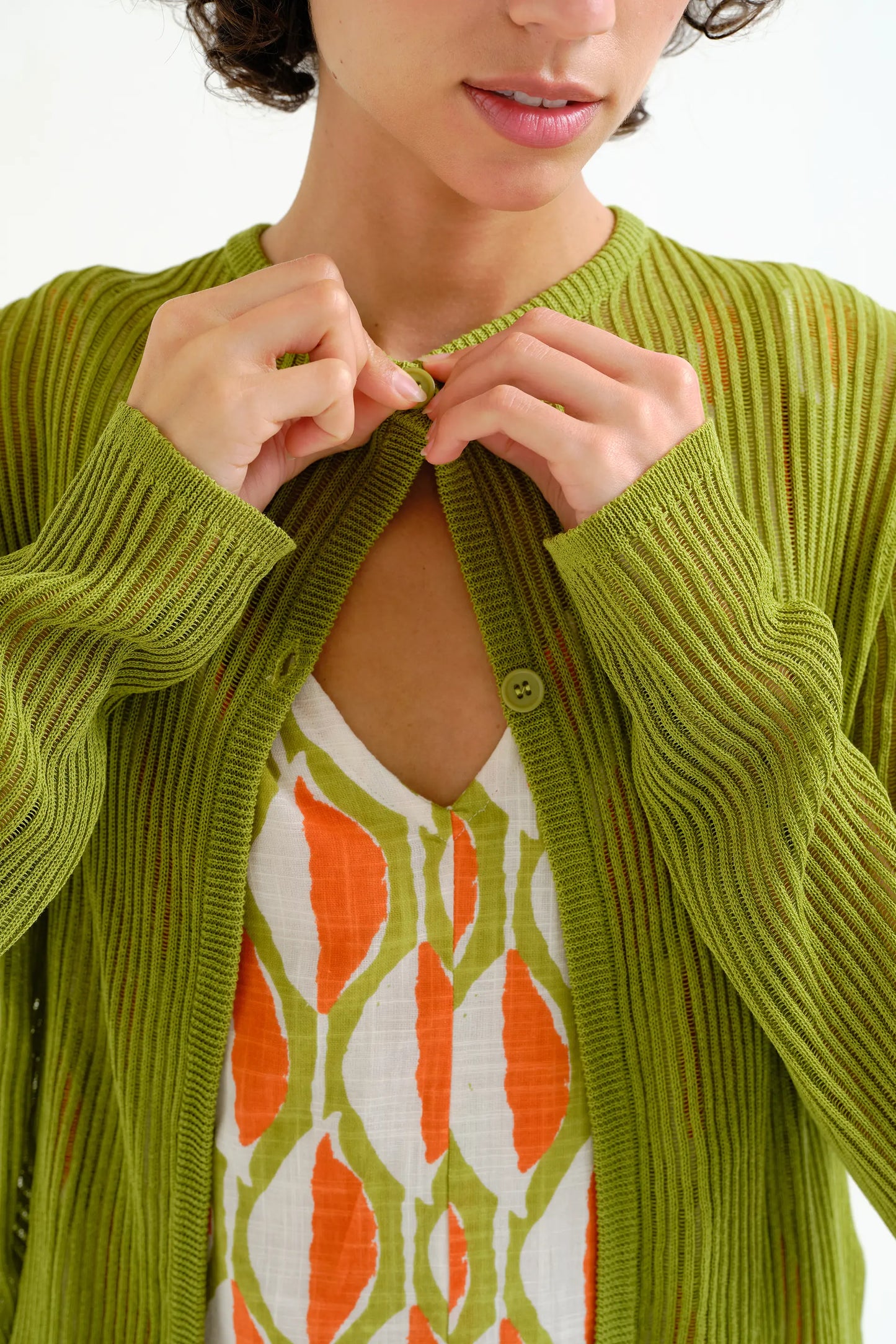 Long-sleeved green knit cardigan