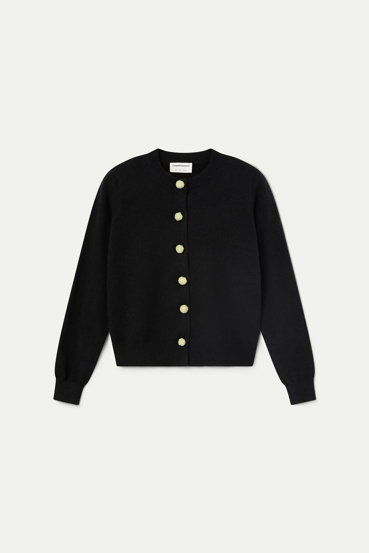 Cárdigan negro con pompones blancos