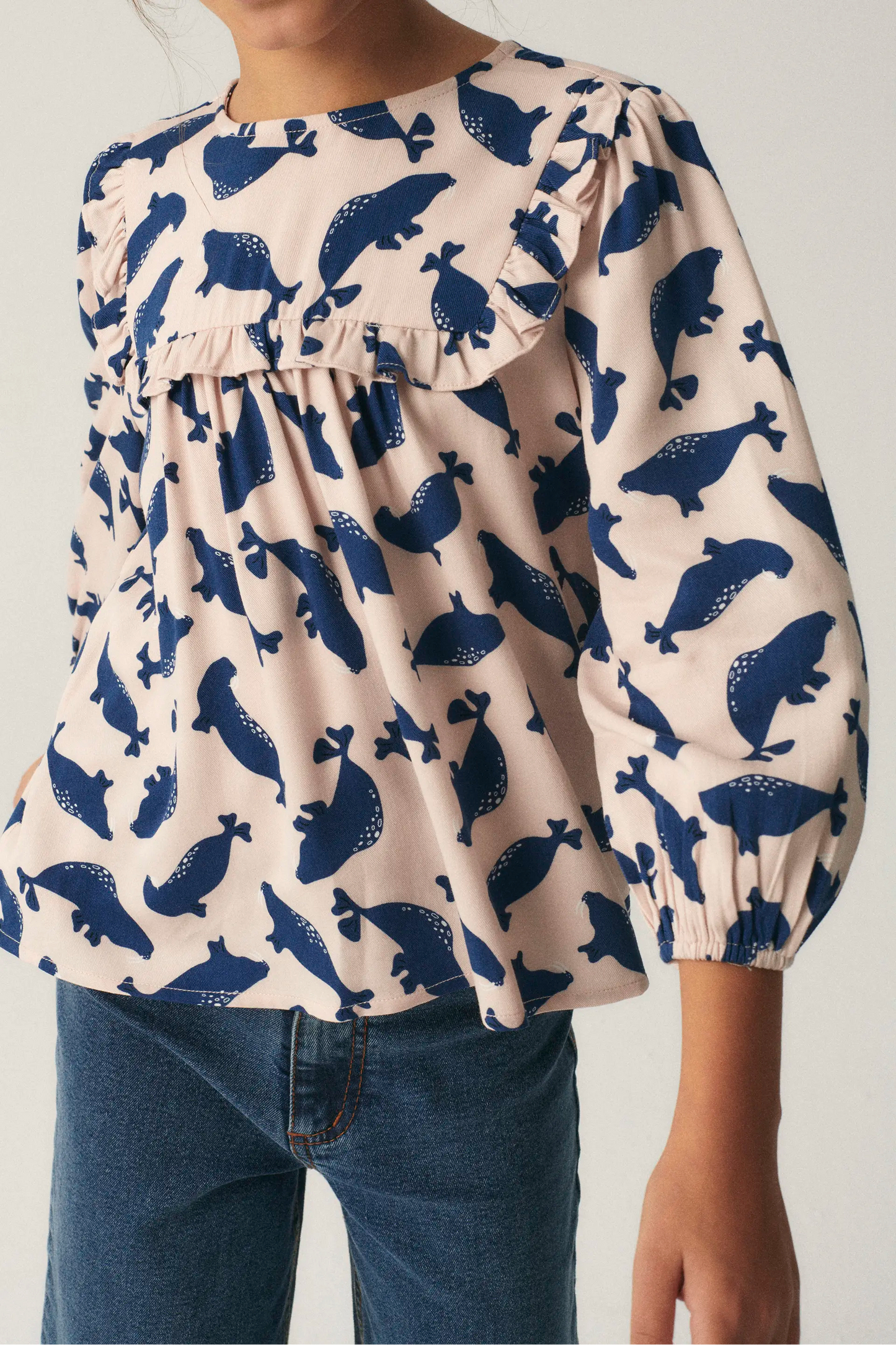 Girl's top with ruffles and seal print