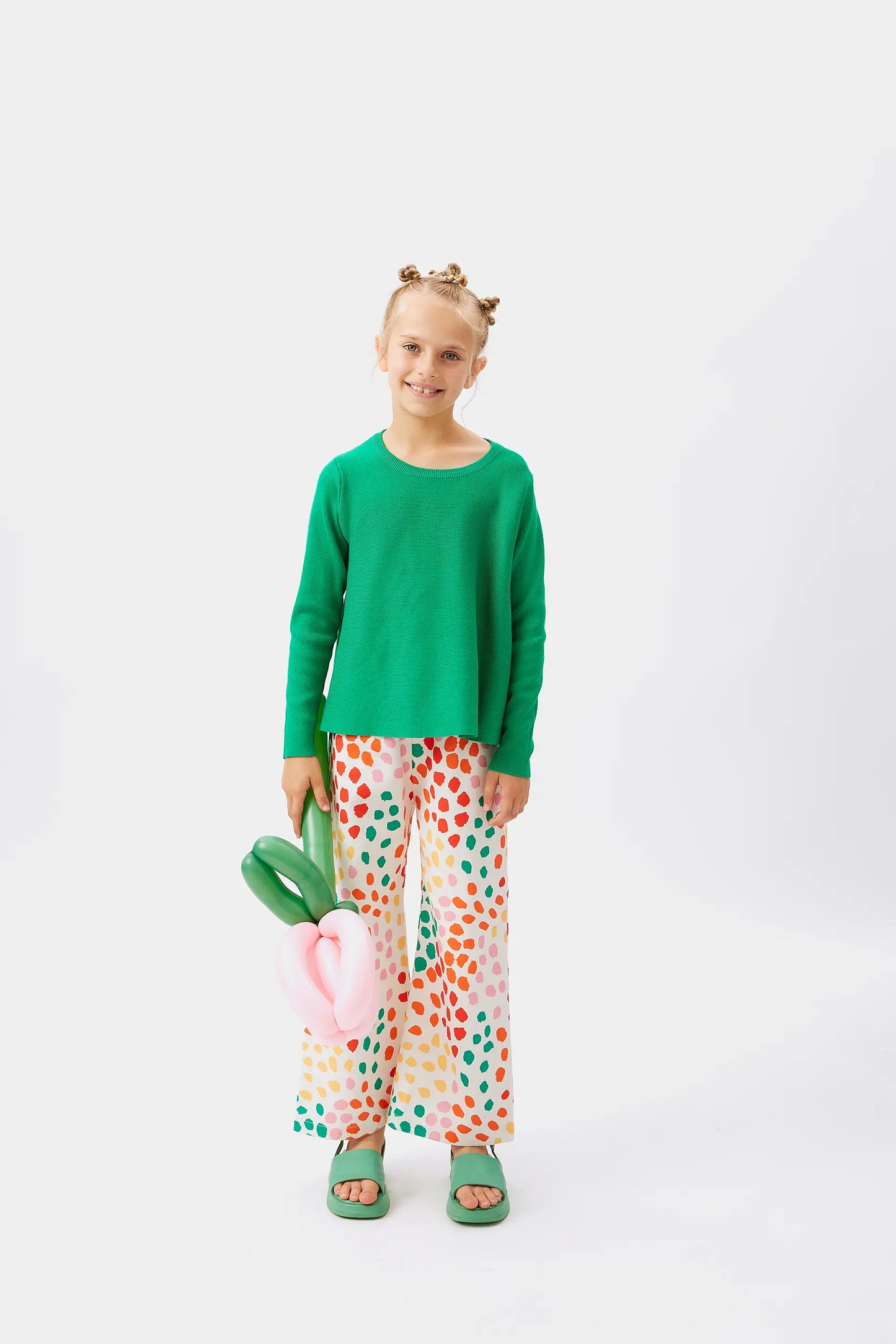 Girl's green flared sweater