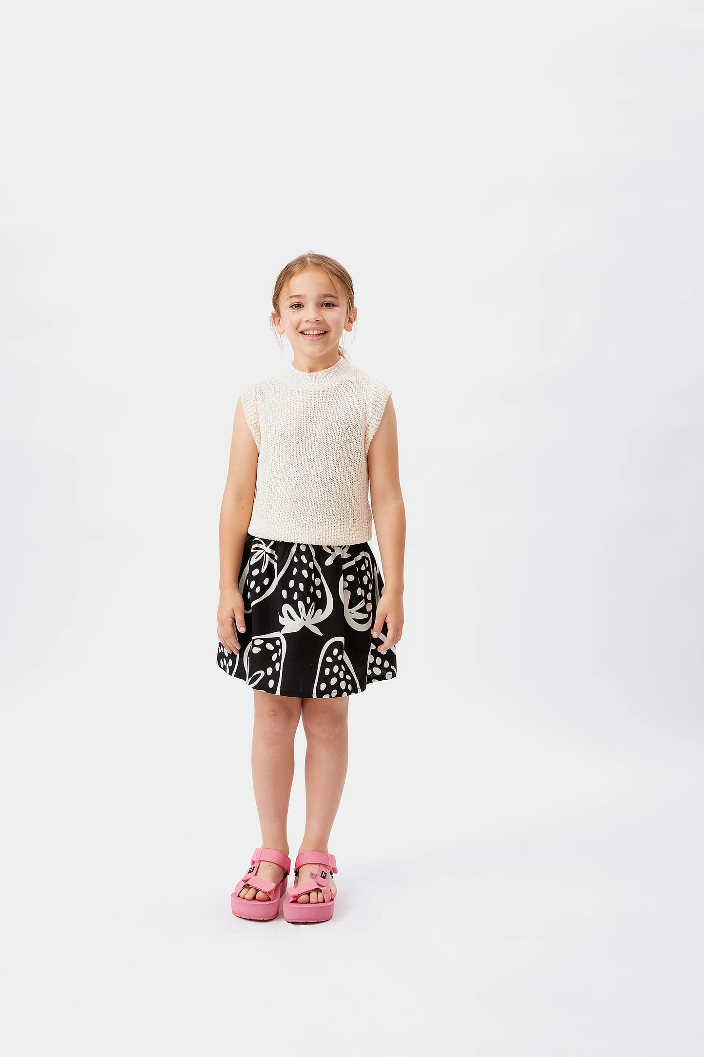 Top bianco senza maniche da bambina