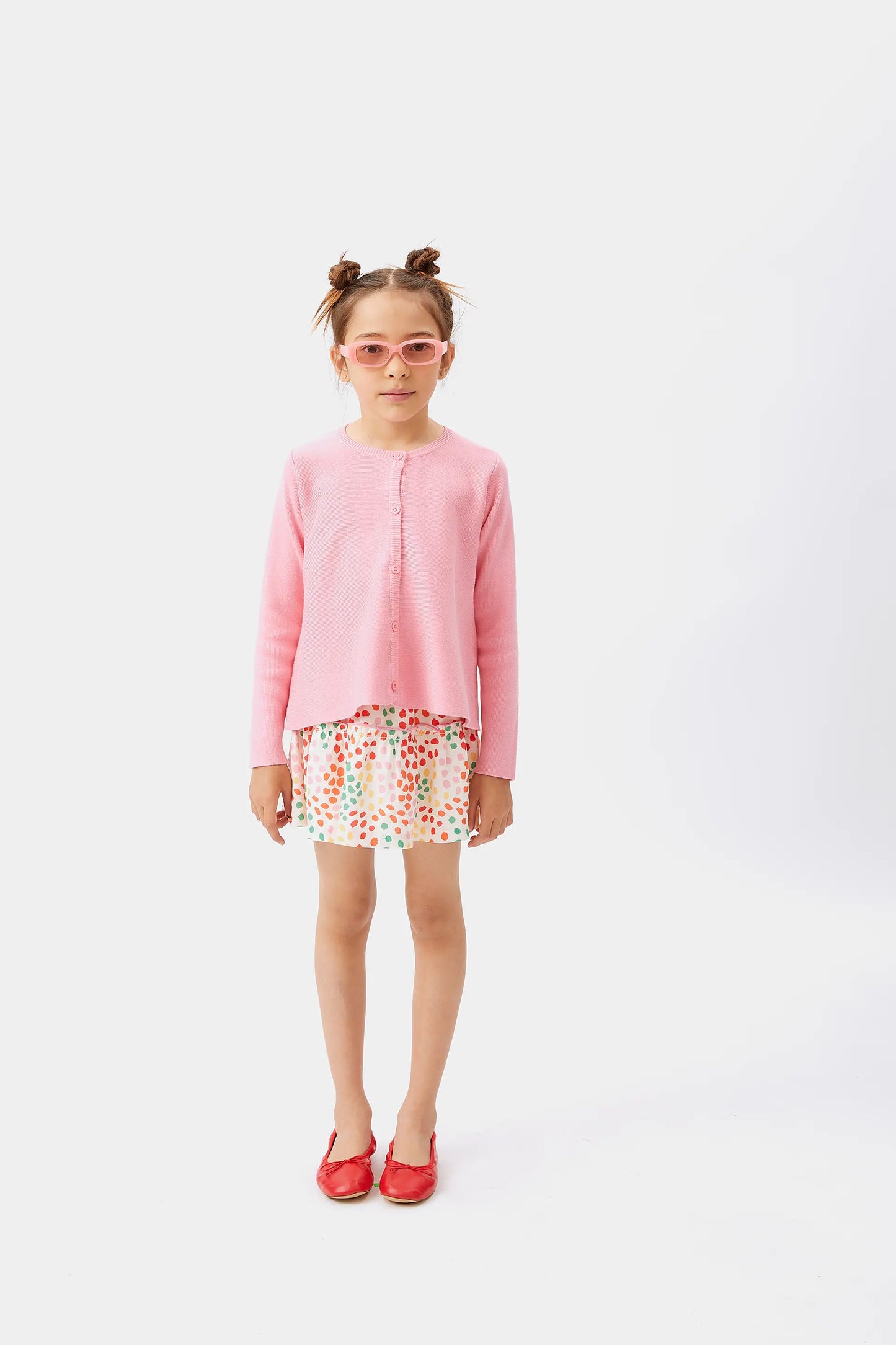 Cardigan svasato rosa da bambina