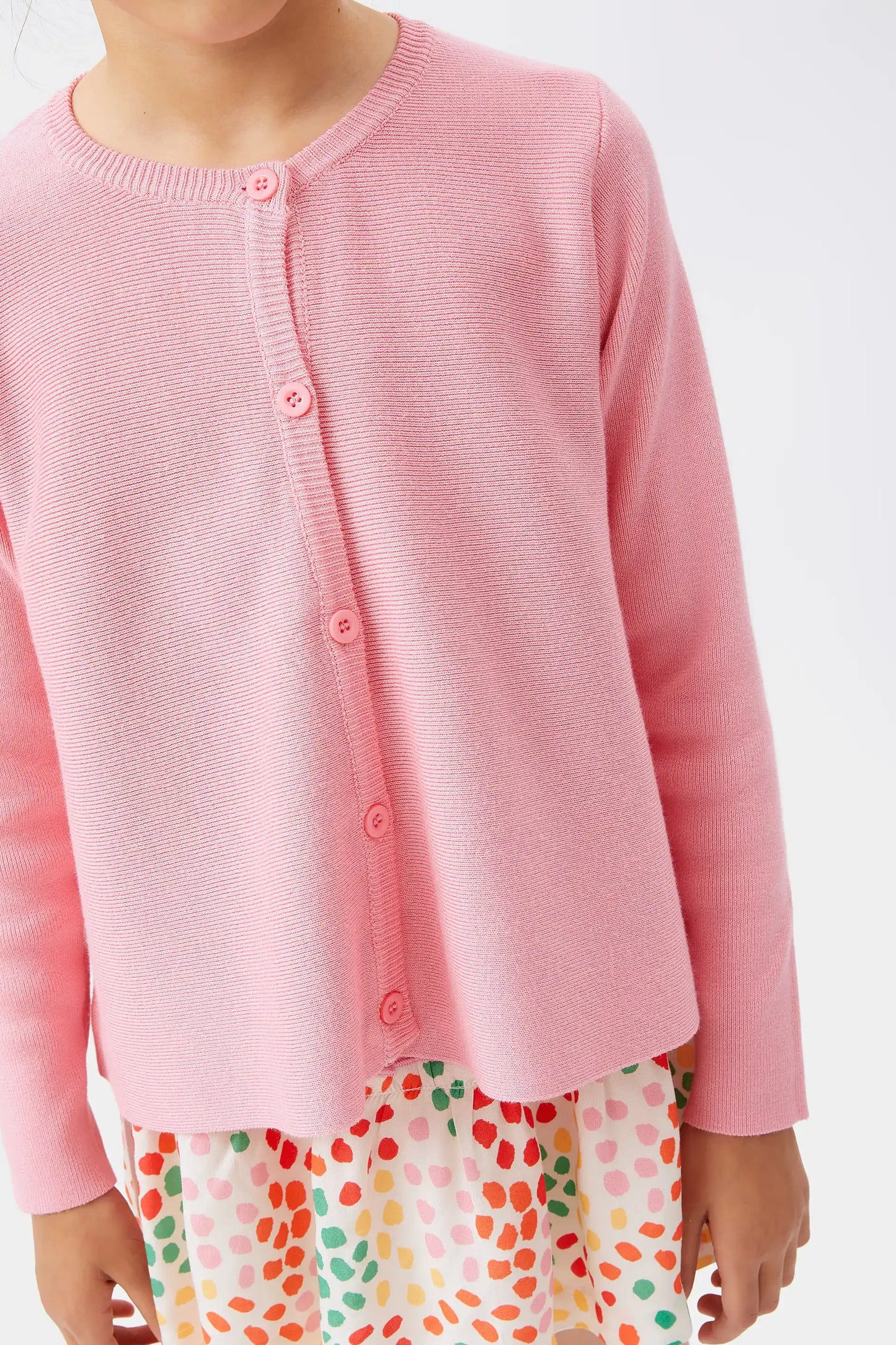 Cardigan svasato rosa da bambina