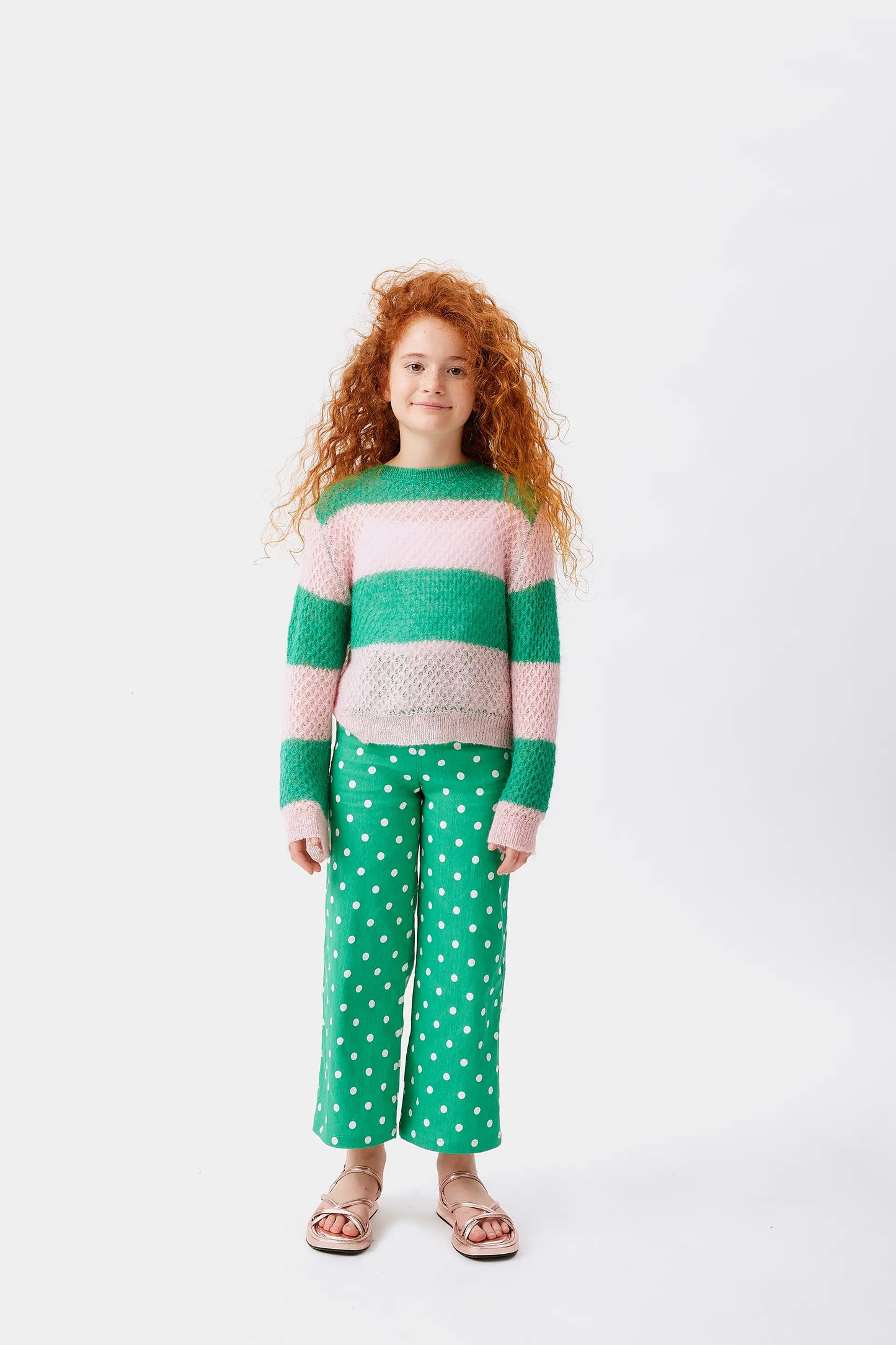 Girl's pink striped cable knit sweater