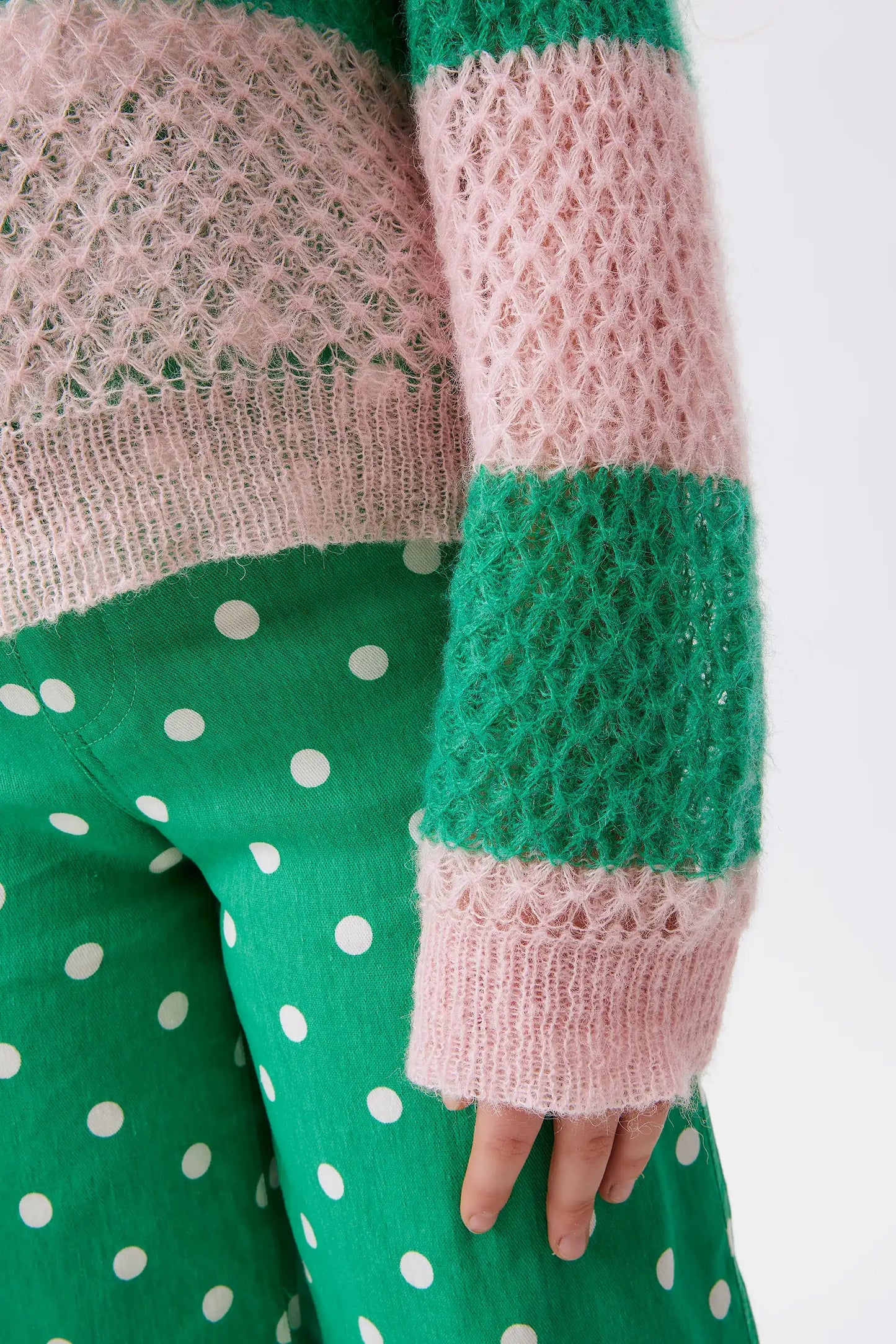 Girl's pink striped cable knit sweater