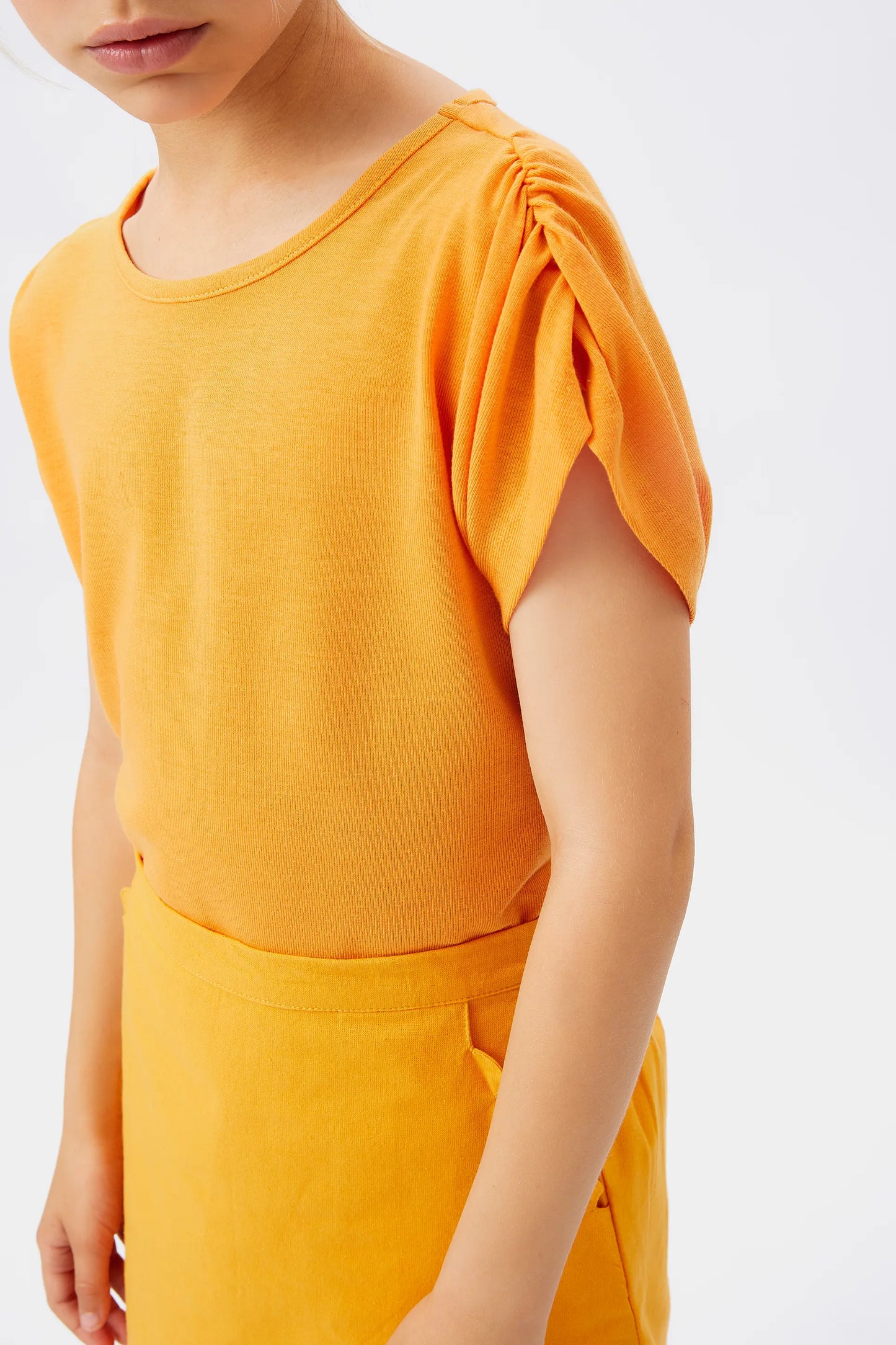 Girl's yellow draped short sleeve top