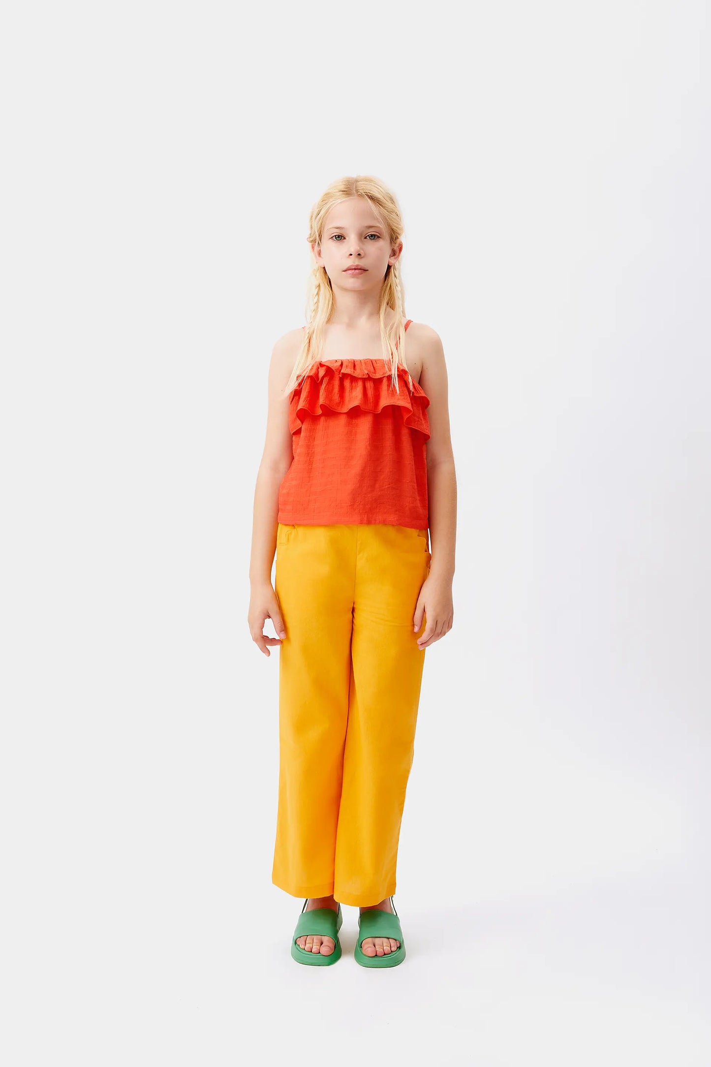 Top arancione senza spalline da bambina