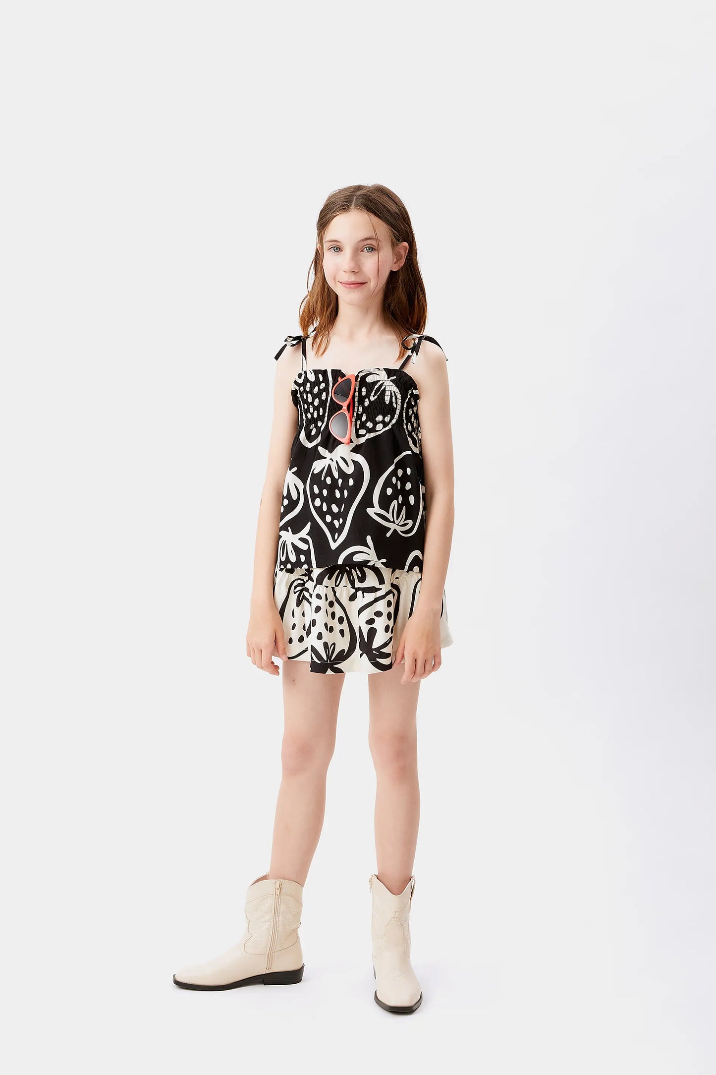 Girl's black strawberry print top