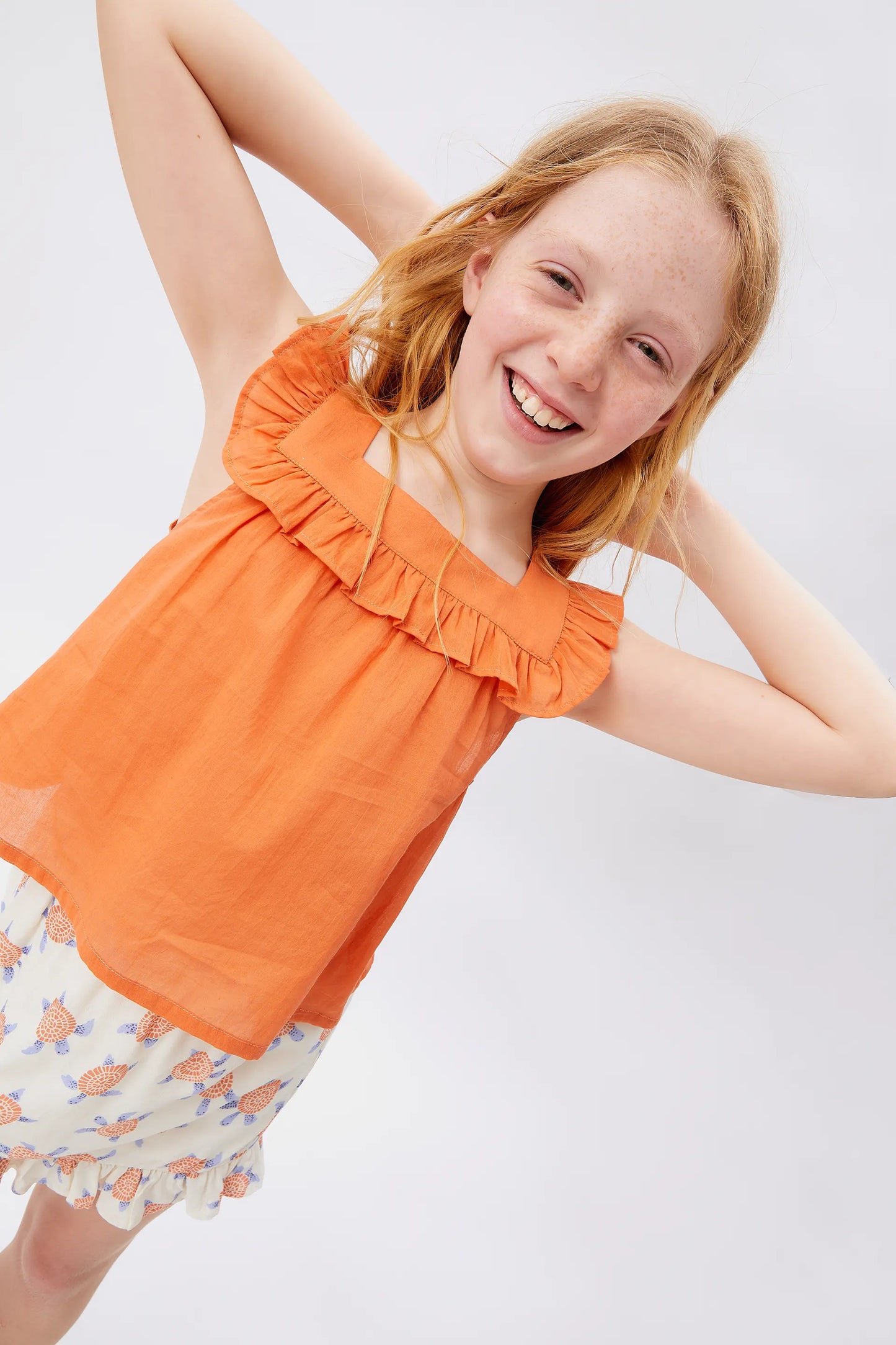 Top de niña volantes naranja