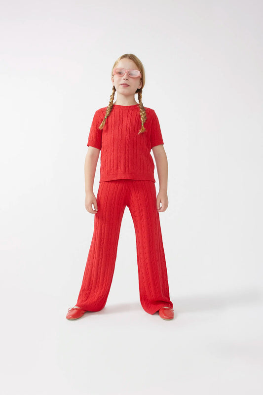 Pantaloni dritti in maglia rossa da ragazza