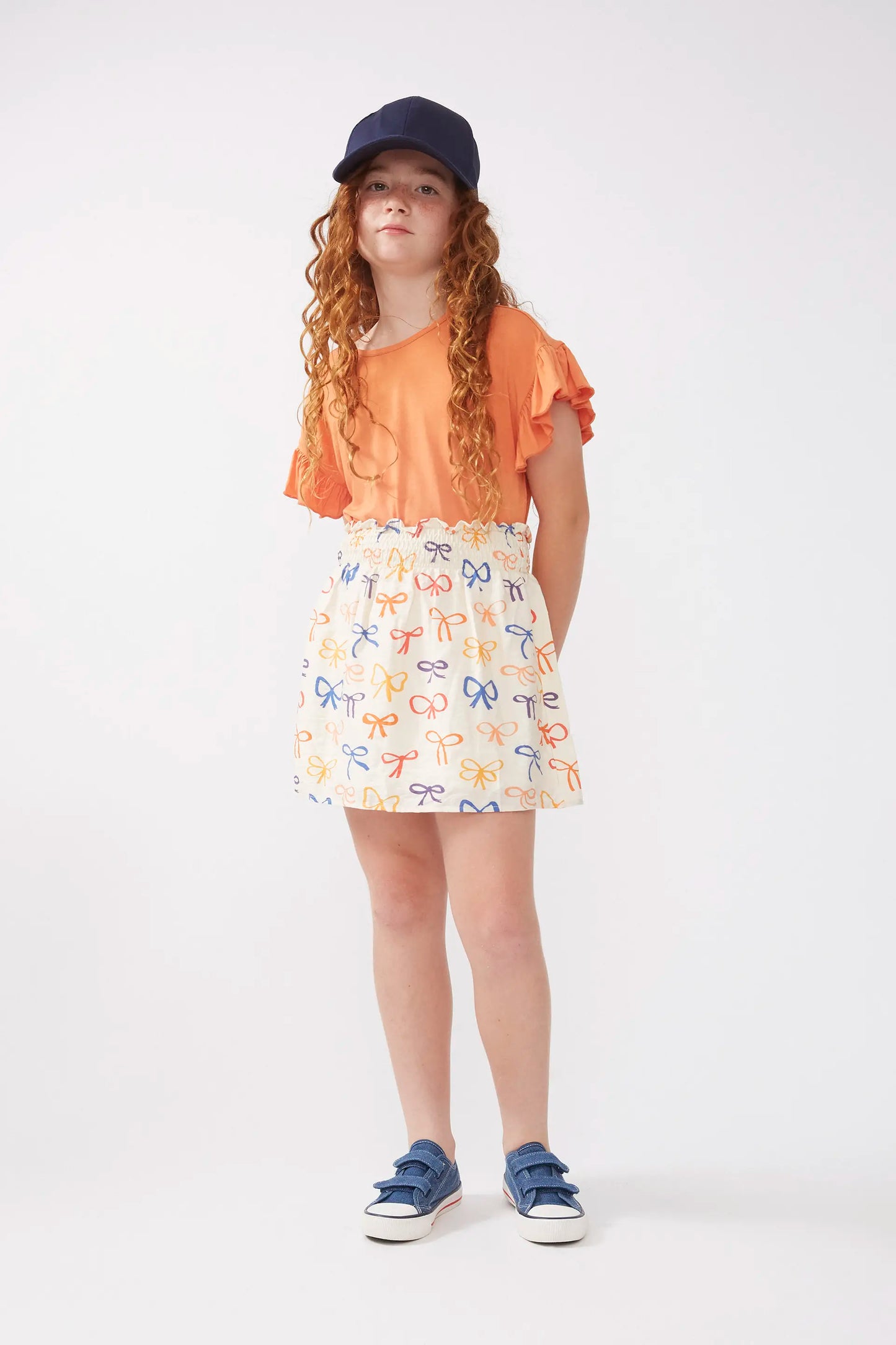 Falda corta de niña estampado lazos