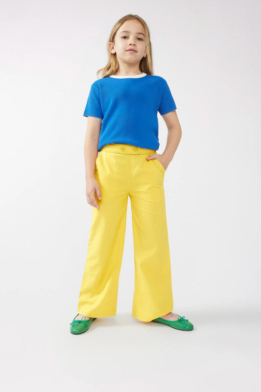 Pantaloni gialli da bambina con bottoni dritti
