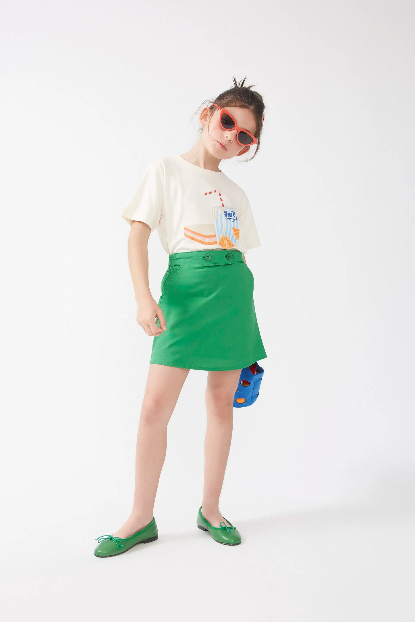 Short skirt for girl with green buttons
