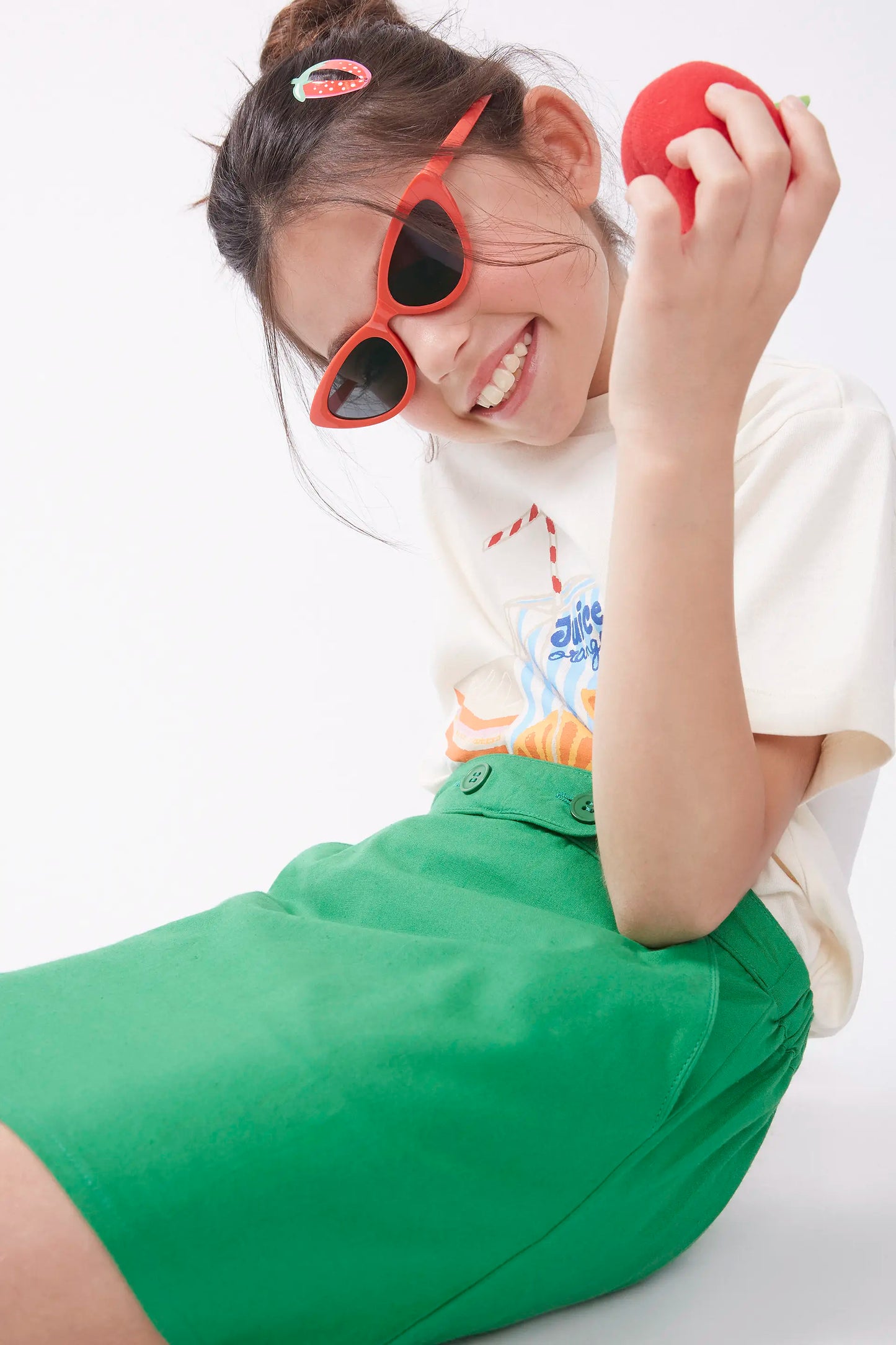 Short skirt for girl with green buttons