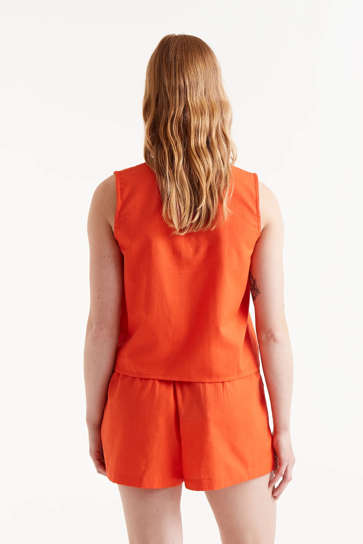 Orange button-down top