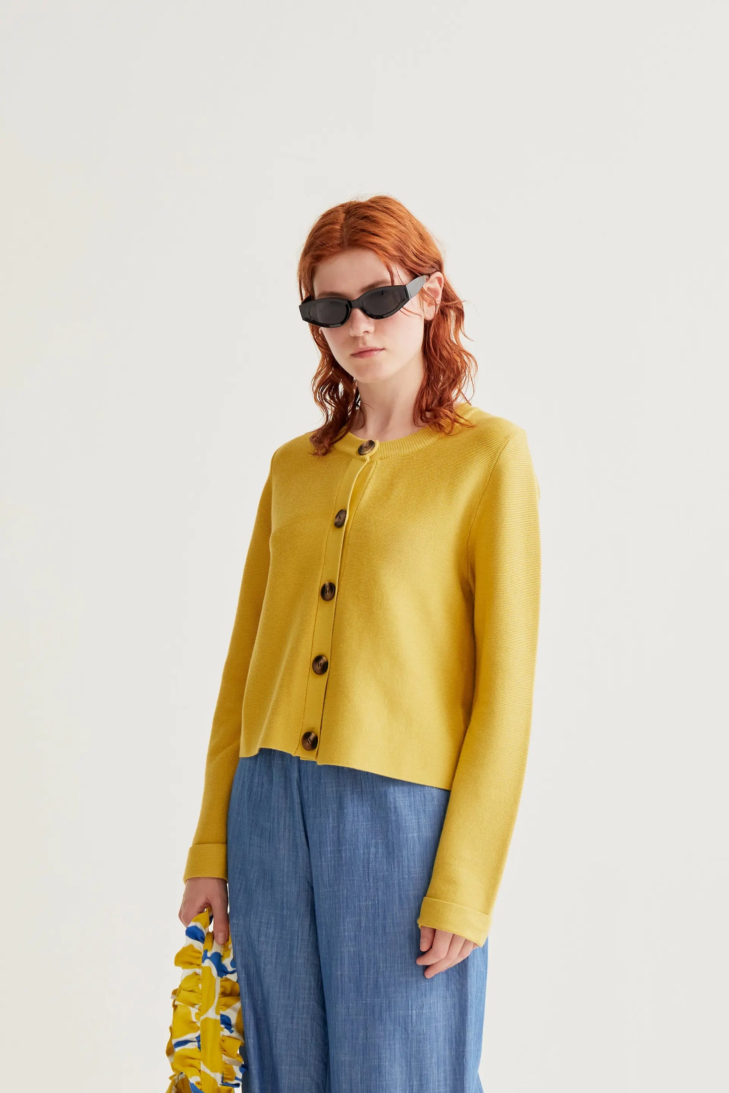 Yellow knit cardigan with large buttons