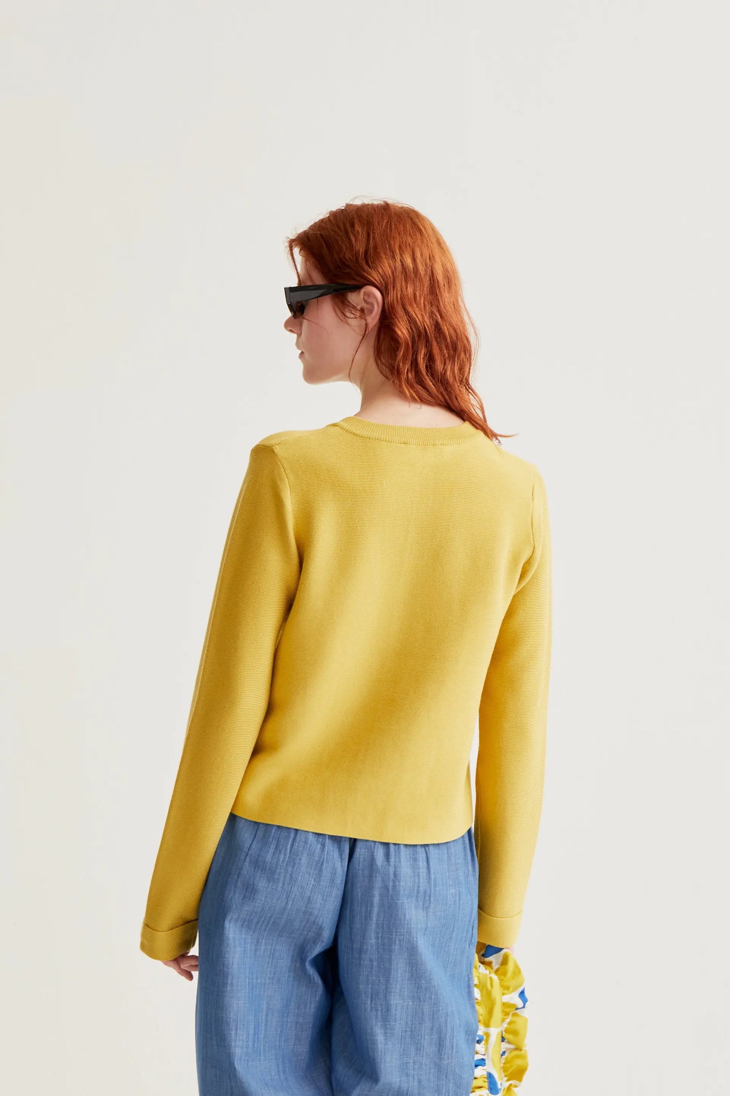 Yellow knit cardigan with large buttons