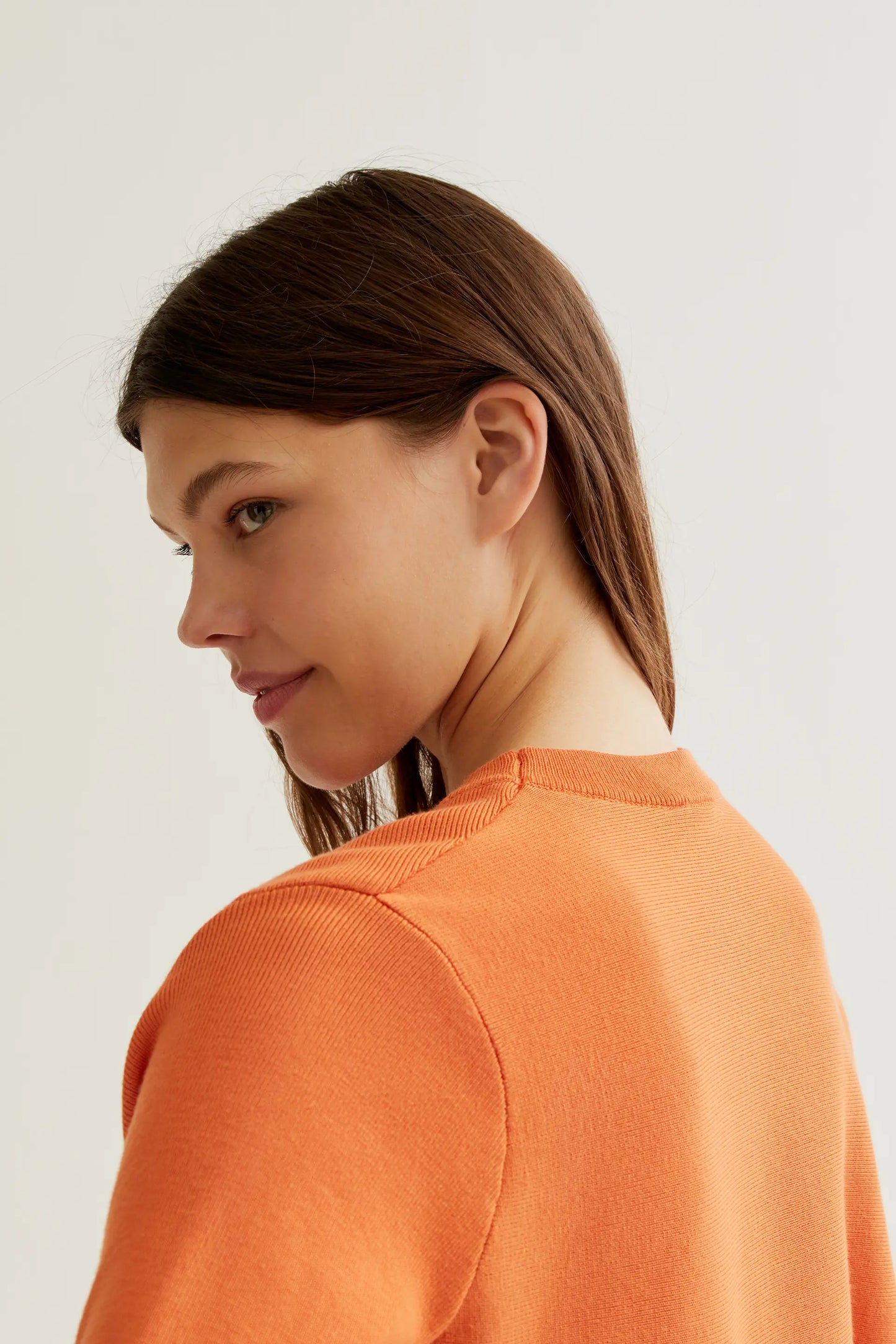 Orange long-sleeved knit sweater