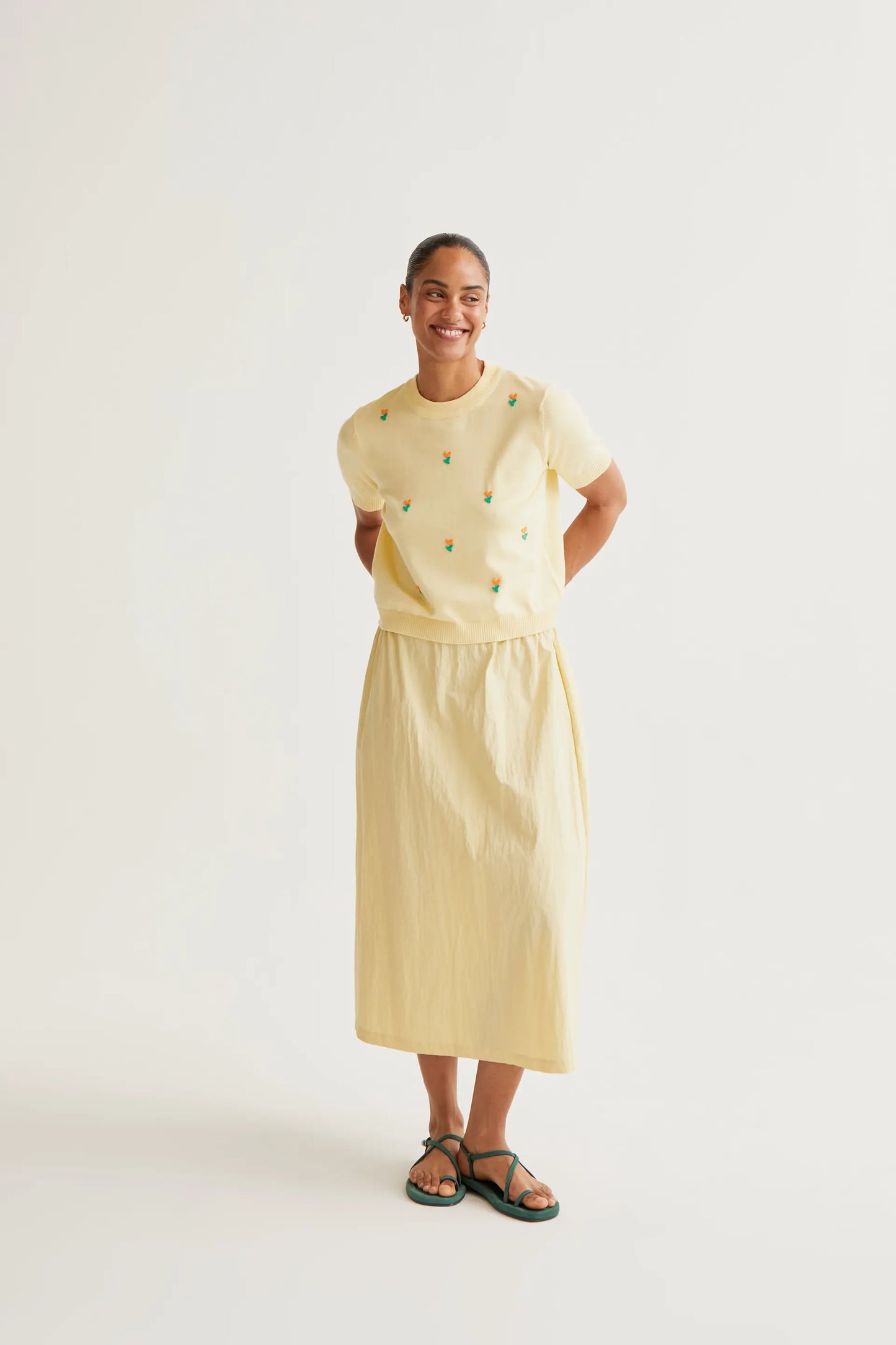 Soft yellow knit top with flowers