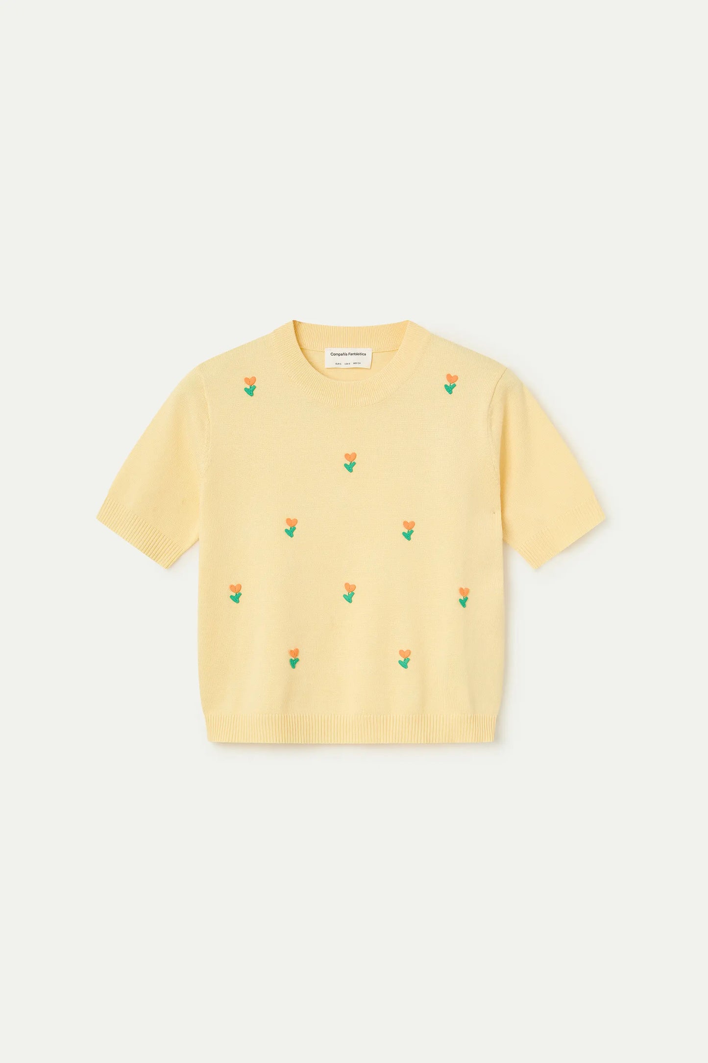Soft yellow knit top with flowers