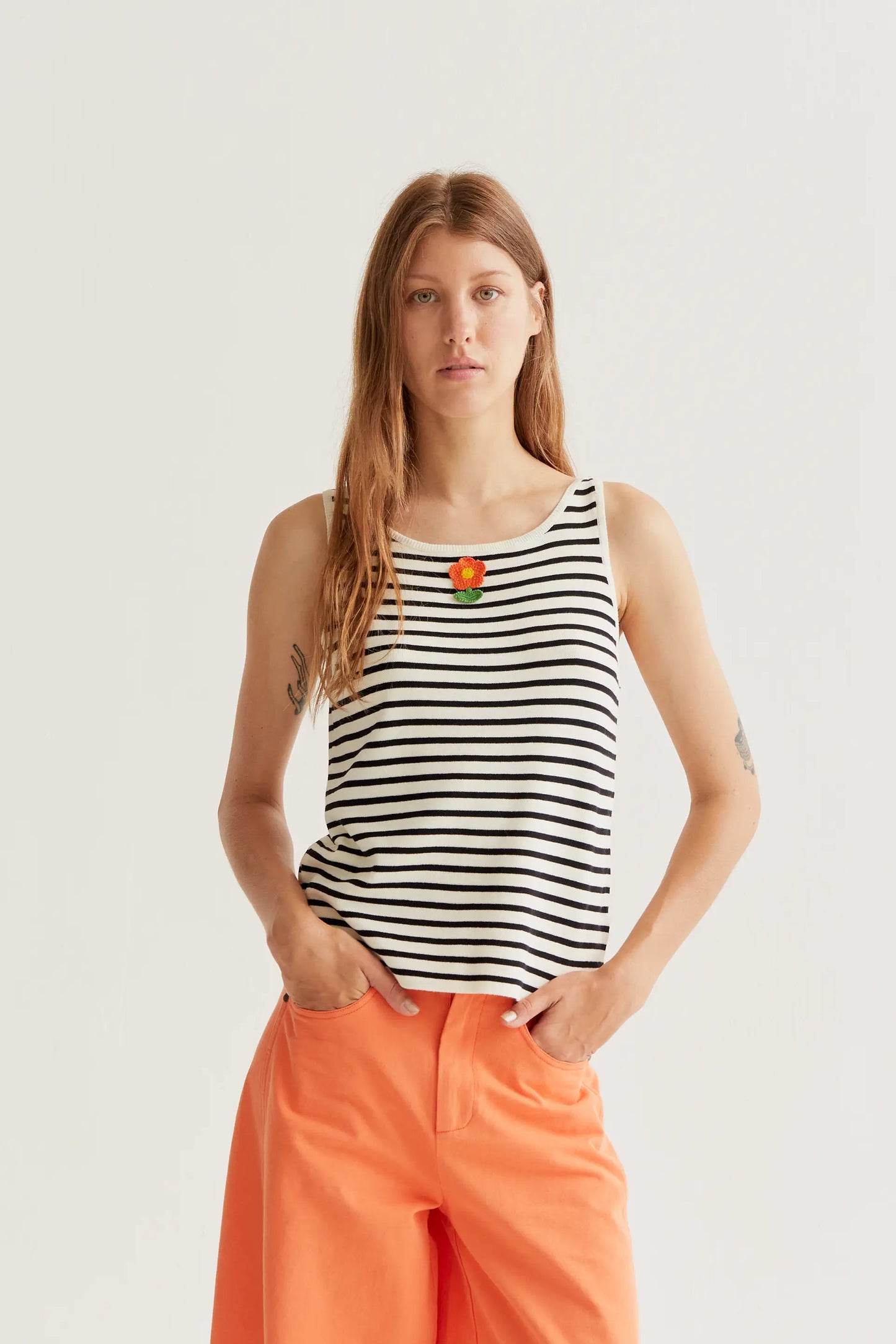 Black and white striped top with floral embroidery