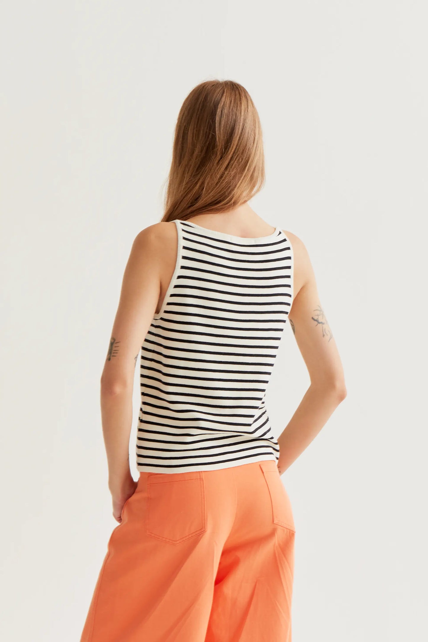Black and white striped top with floral embroidery