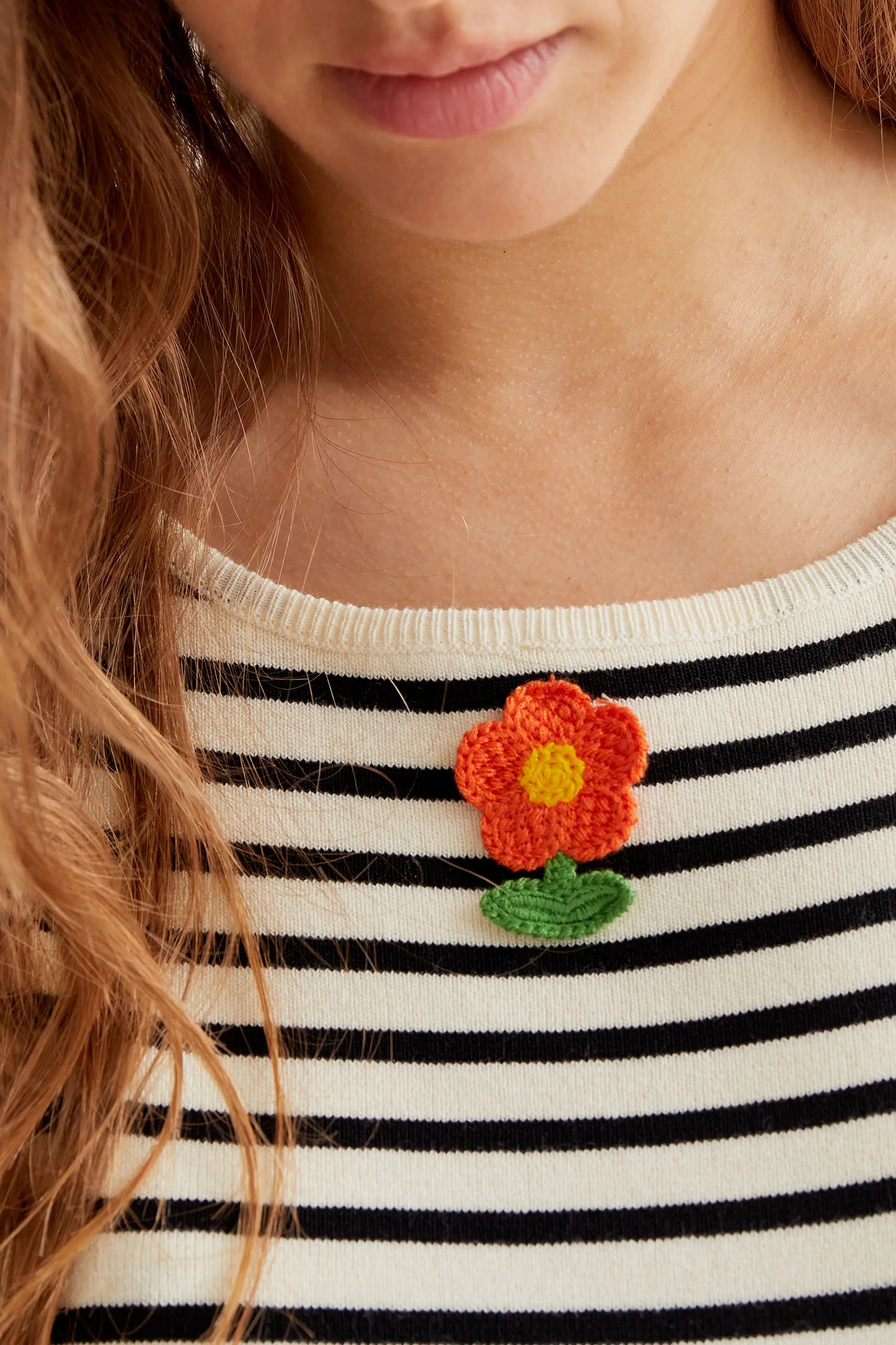 Black and white striped top with floral embroidery