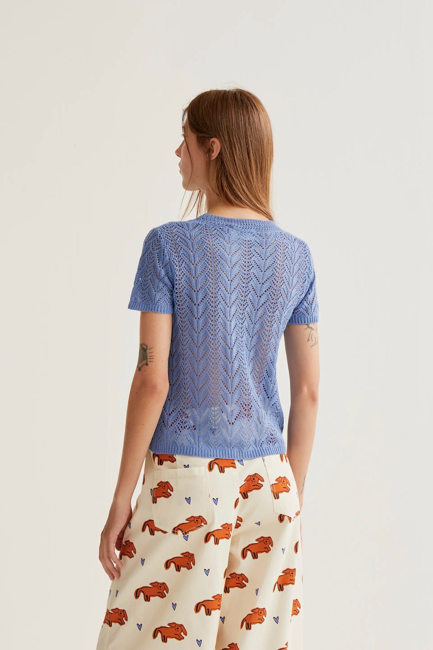Light blue openwork embroidered top in the shape of a flower
