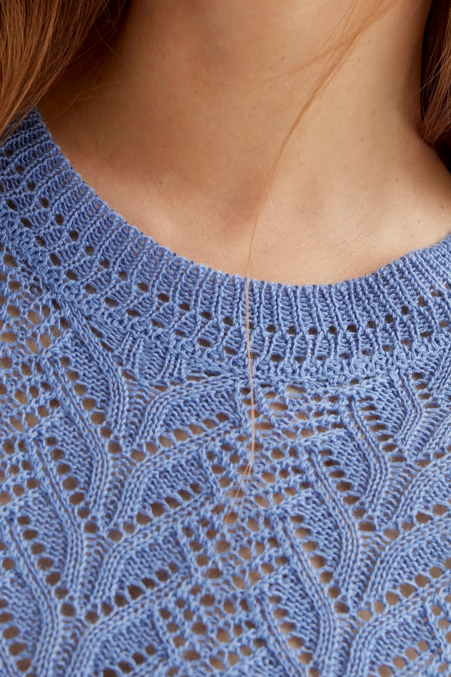 Light blue openwork embroidered top in the shape of a flower