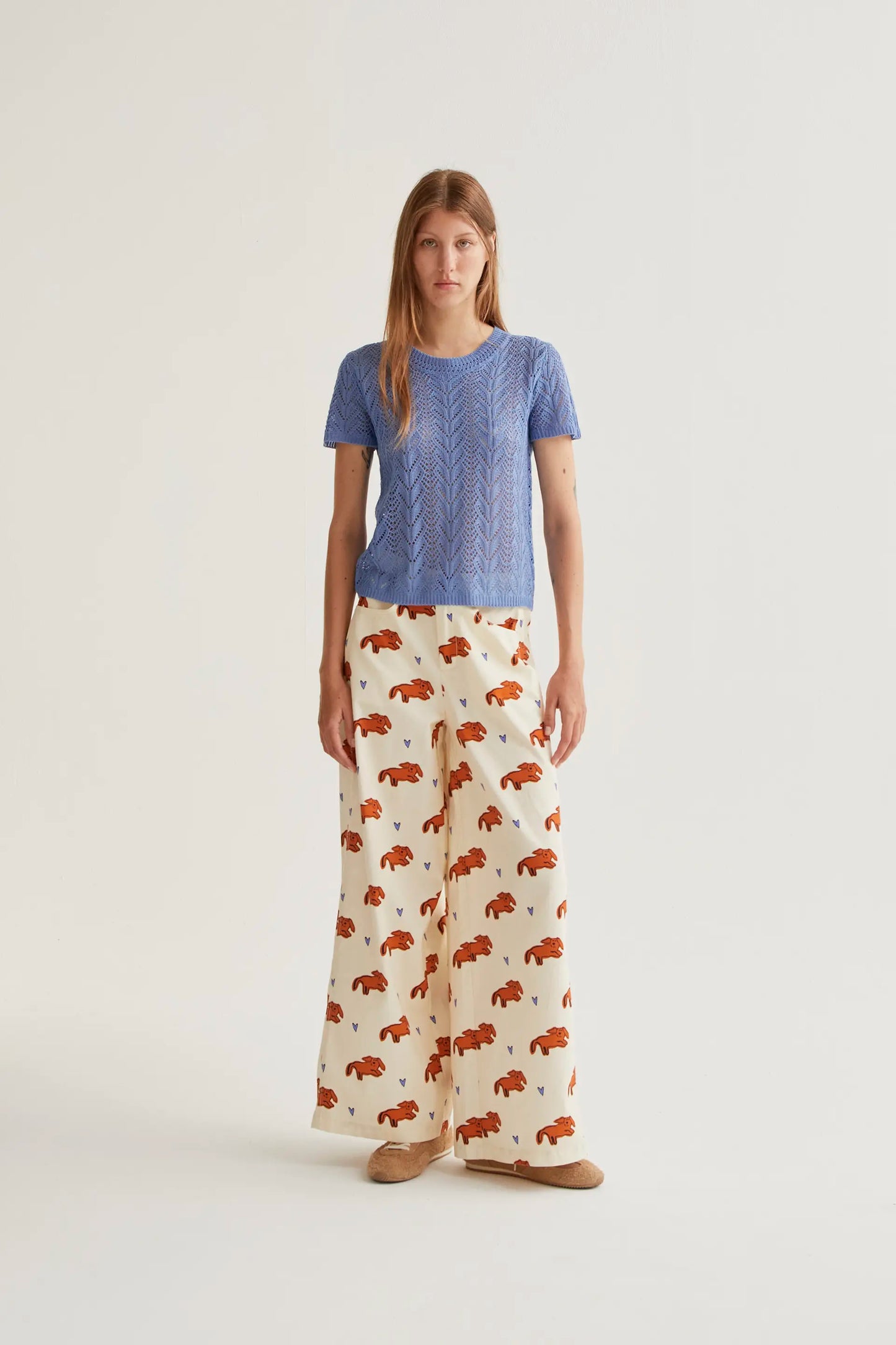 Light blue openwork embroidered top in the shape of a flower