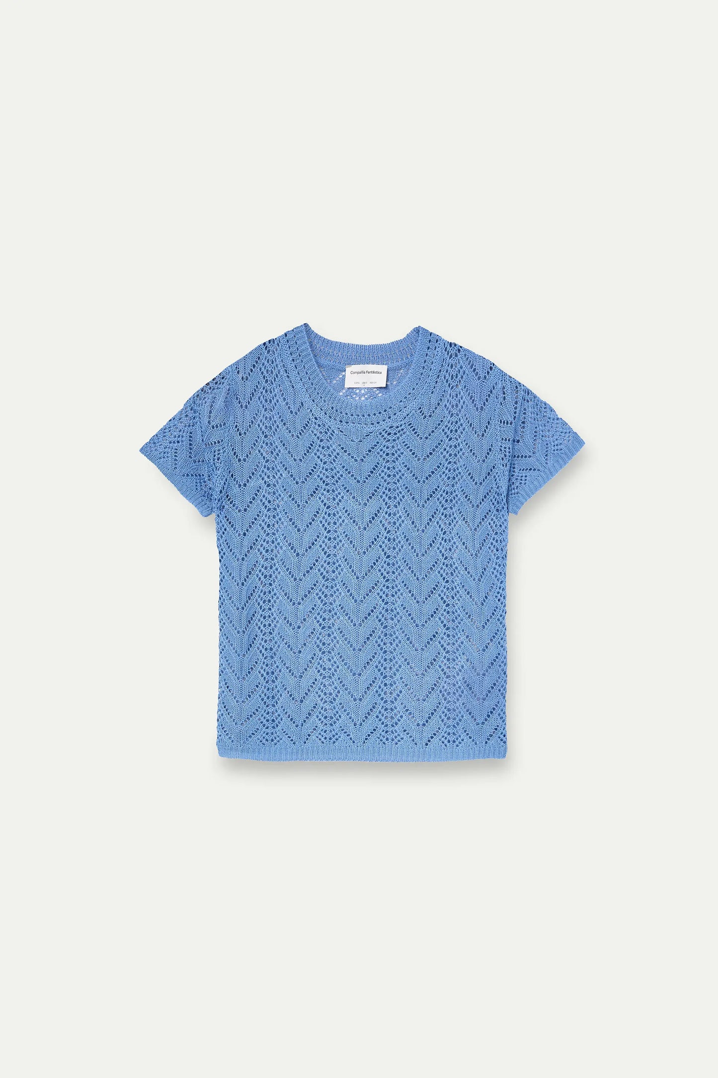 Light blue openwork embroidered top in the shape of a flower