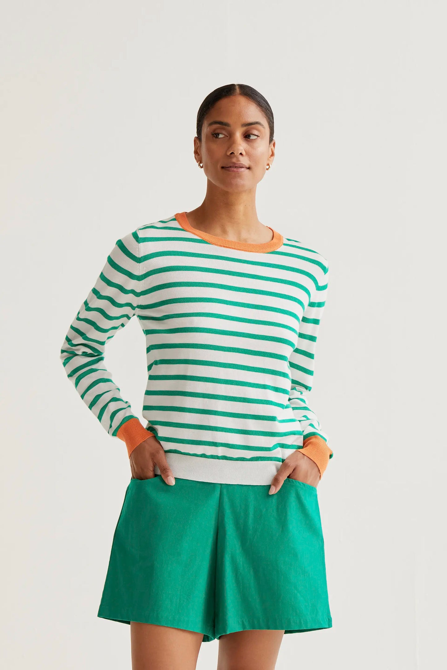 Knitted sweater with white and green striped print