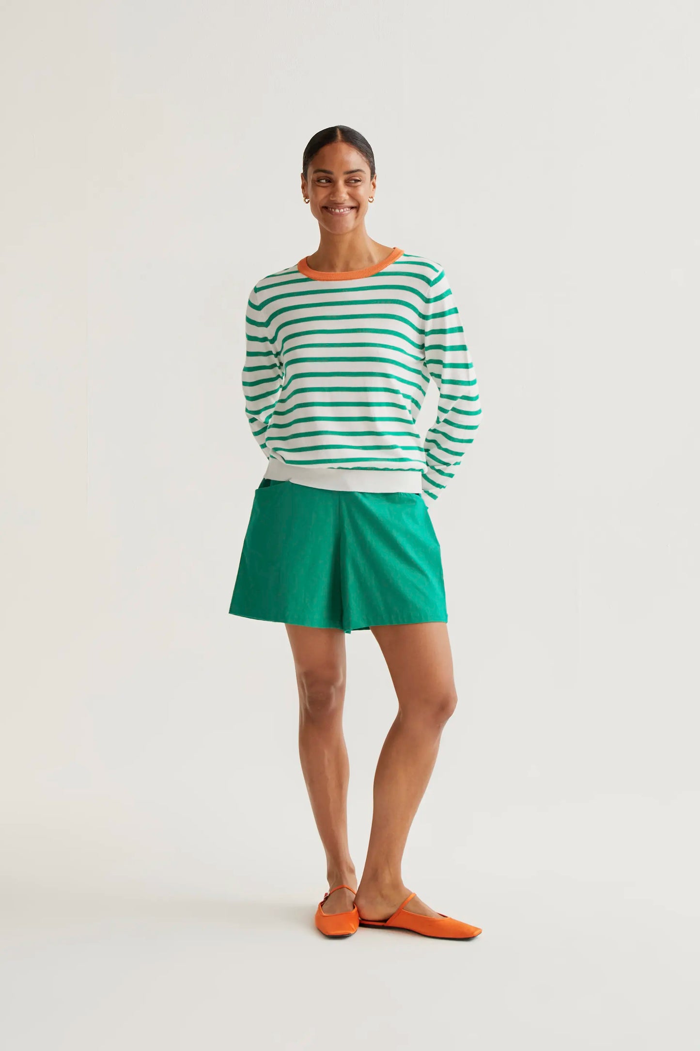 Knitted sweater with white and green striped print