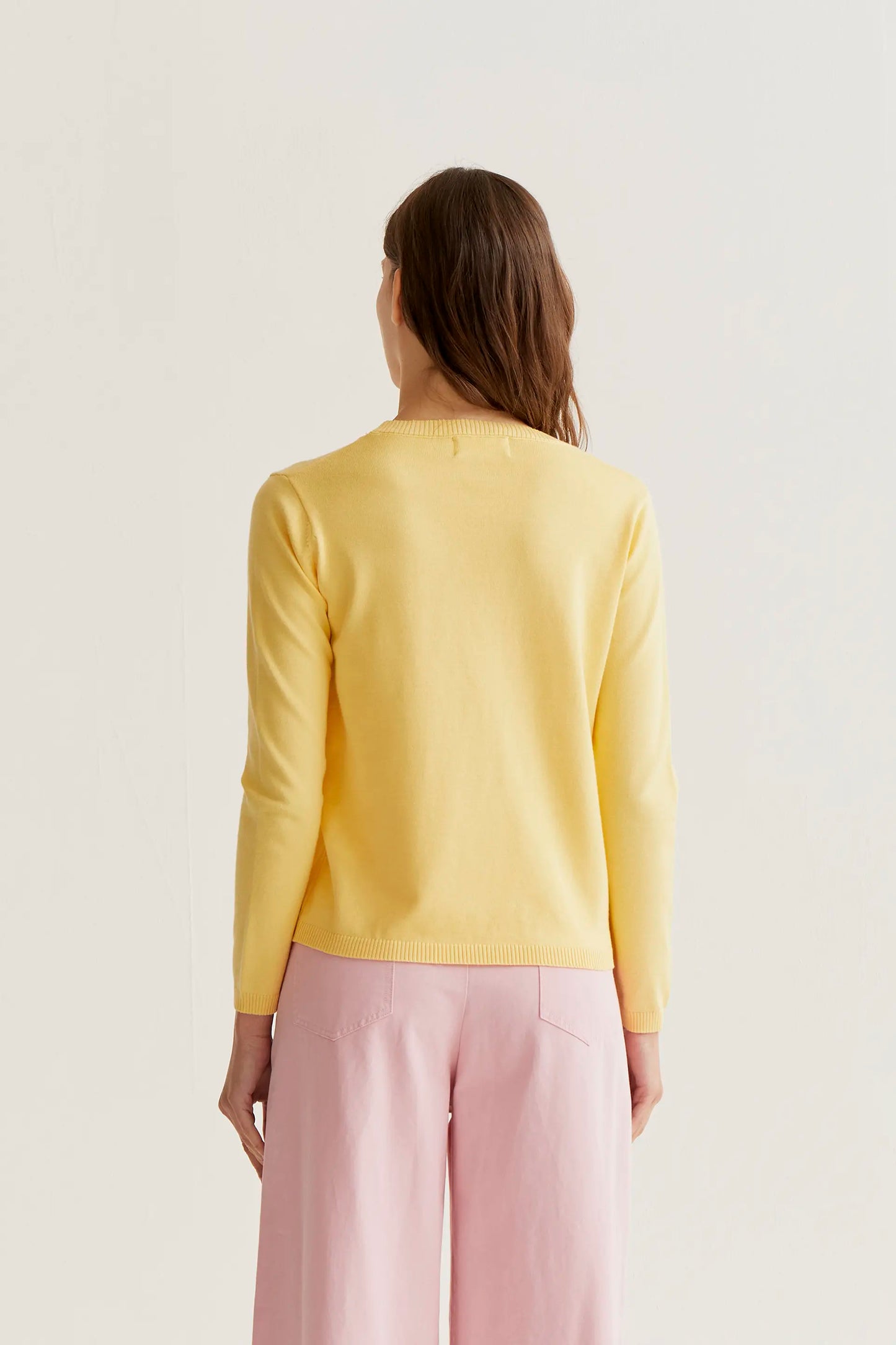 Yellow knit sweater with pink tulip embroidery
