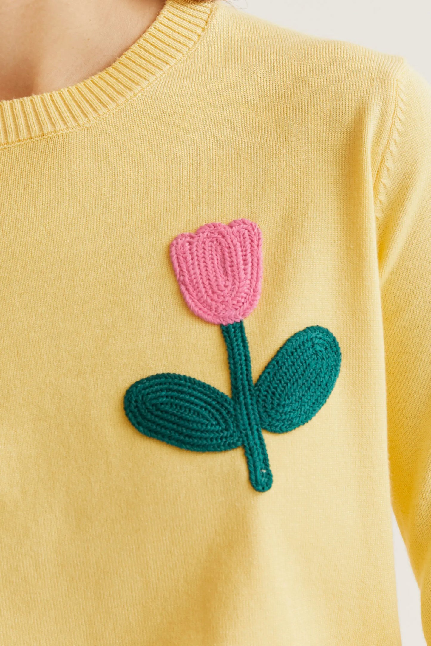 Yellow knit sweater with pink tulip embroidery