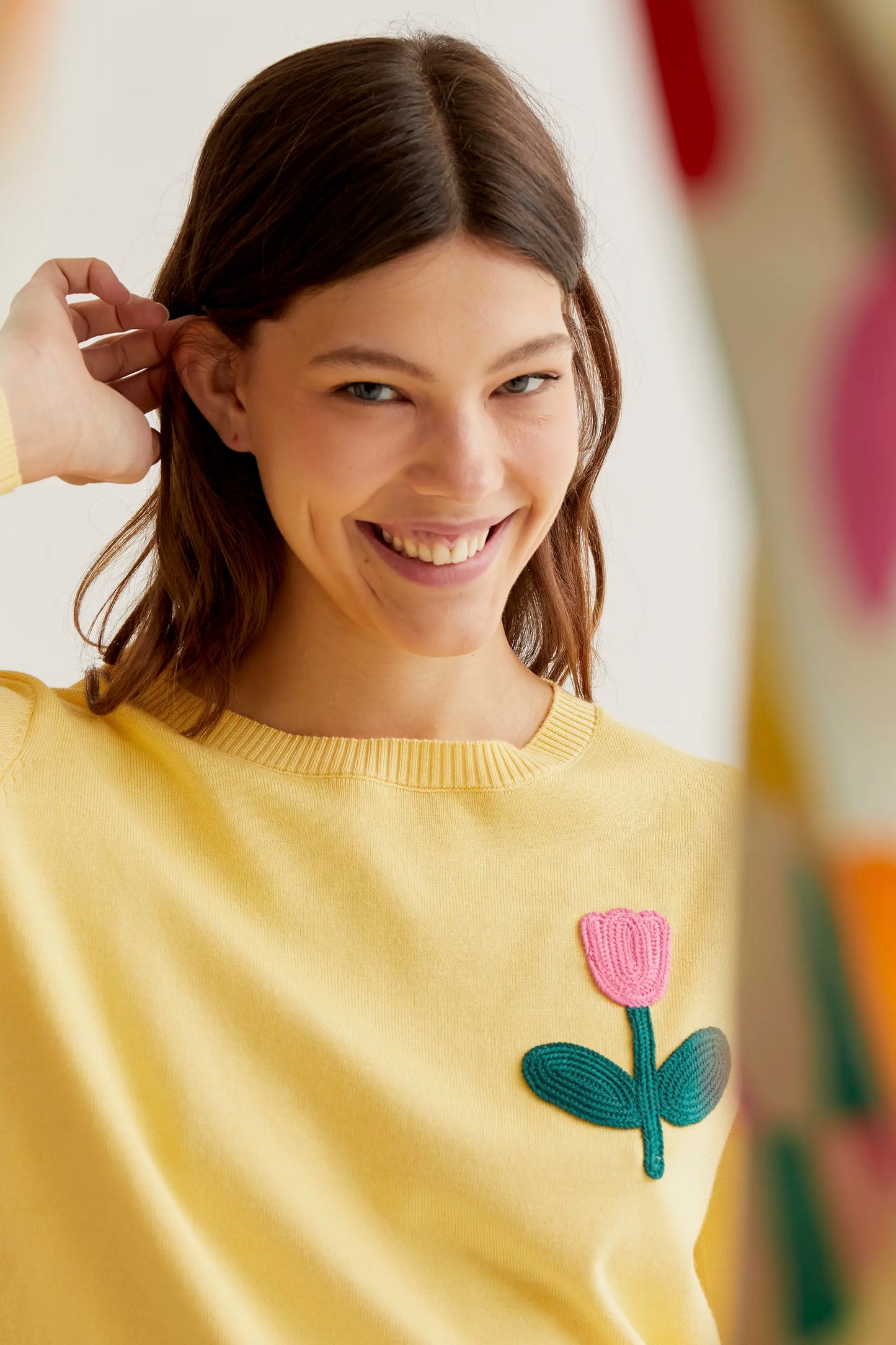 Yellow knit sweater with pink tulip embroidery