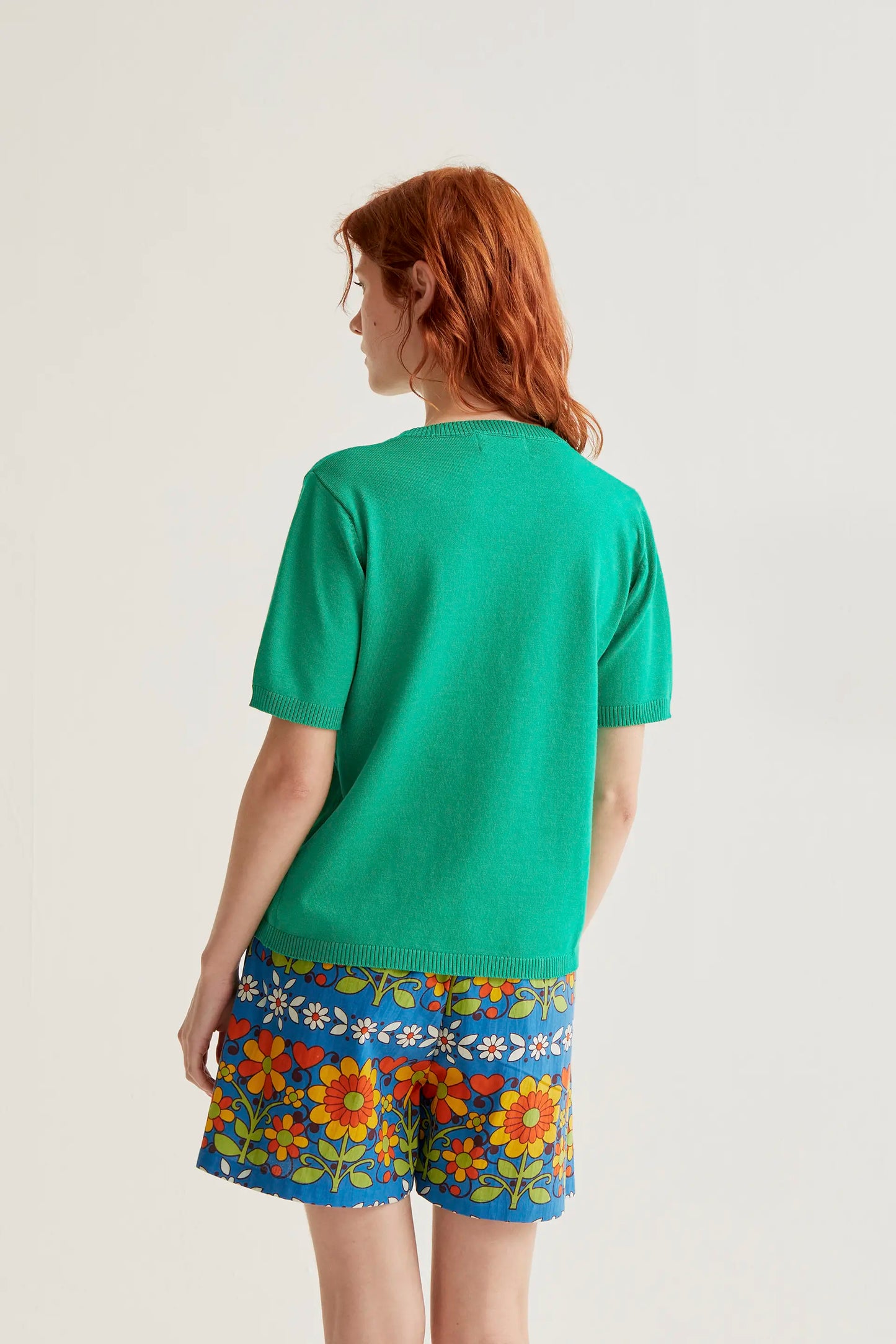 Green knit top with orange embroidery