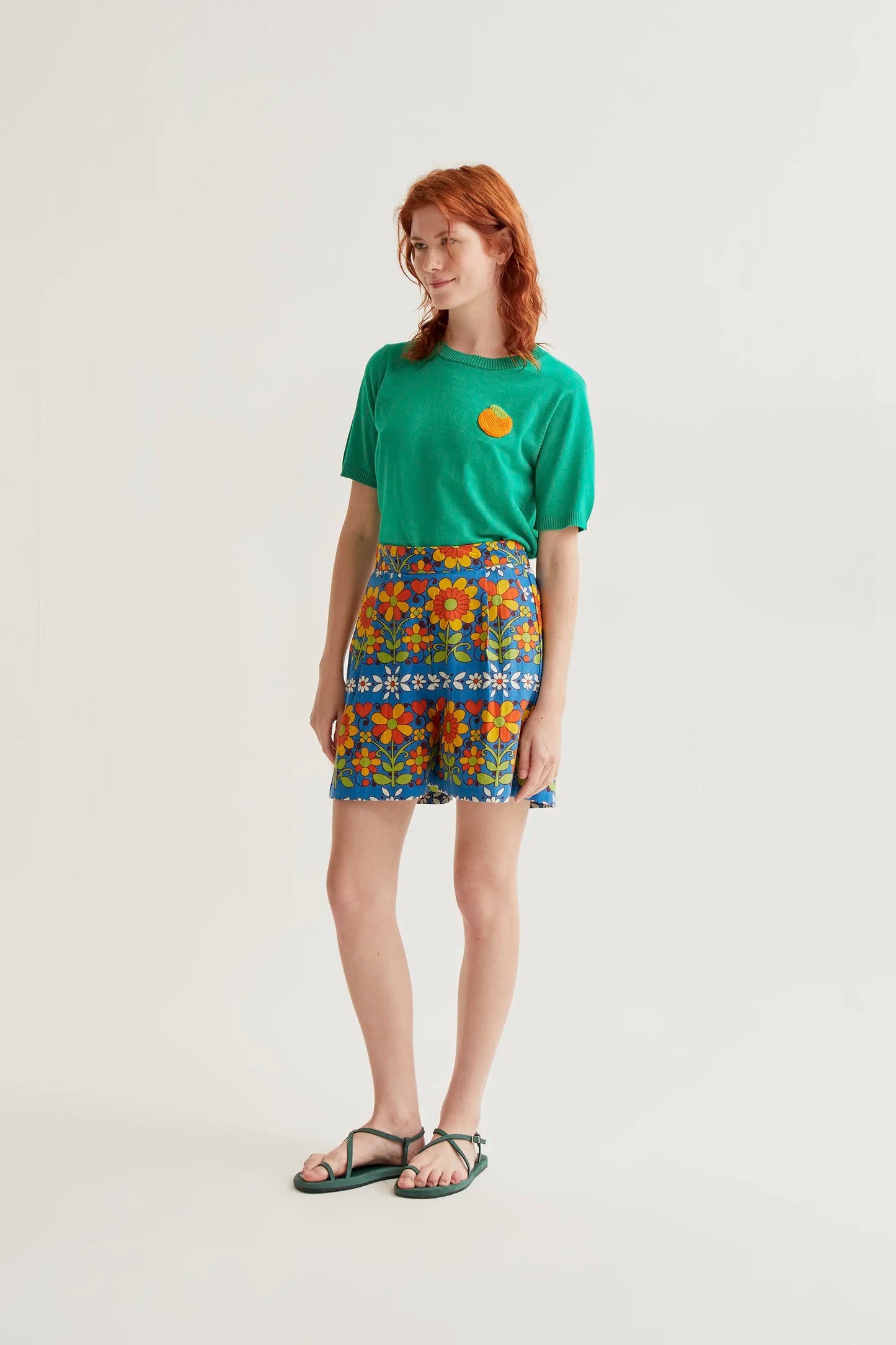Green knit top with orange embroidery