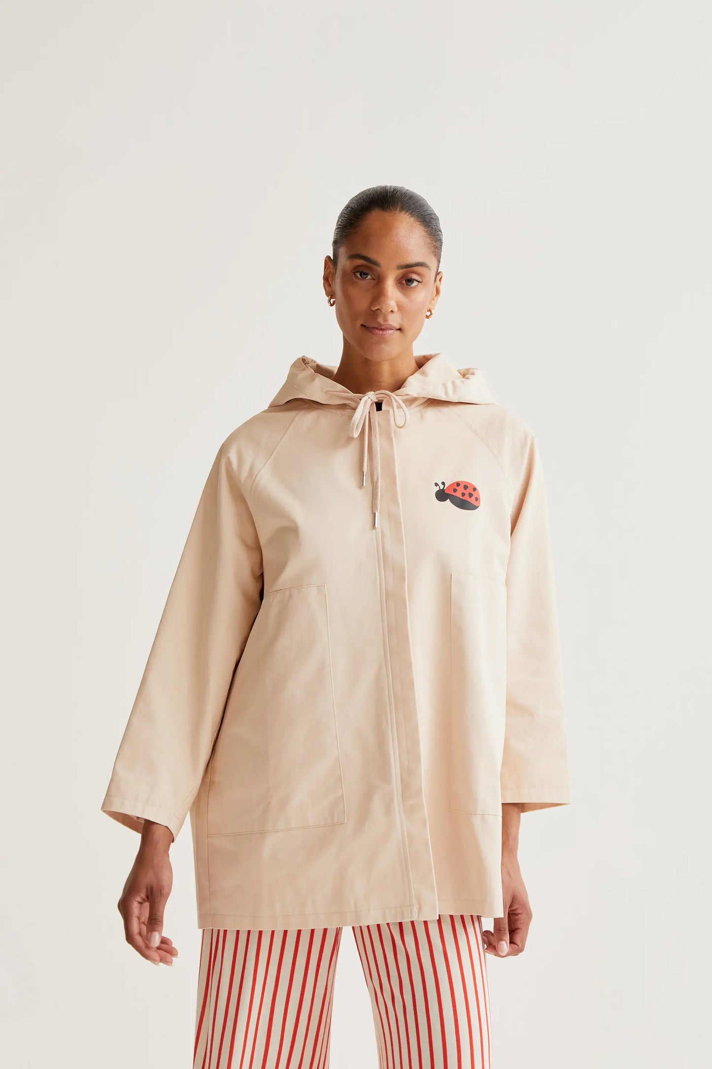 Trench coat with ladybug print