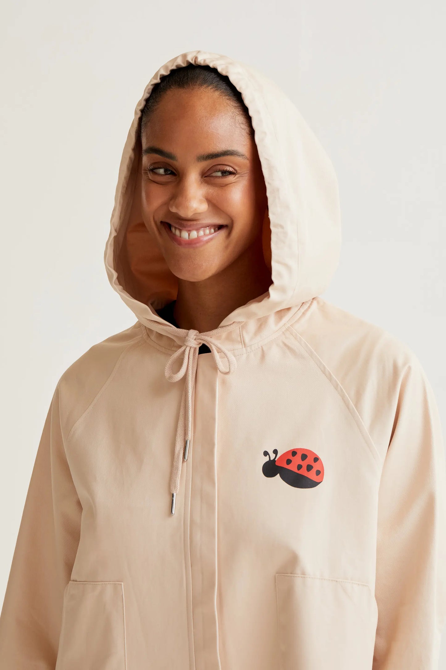 Trench coat with ladybug print