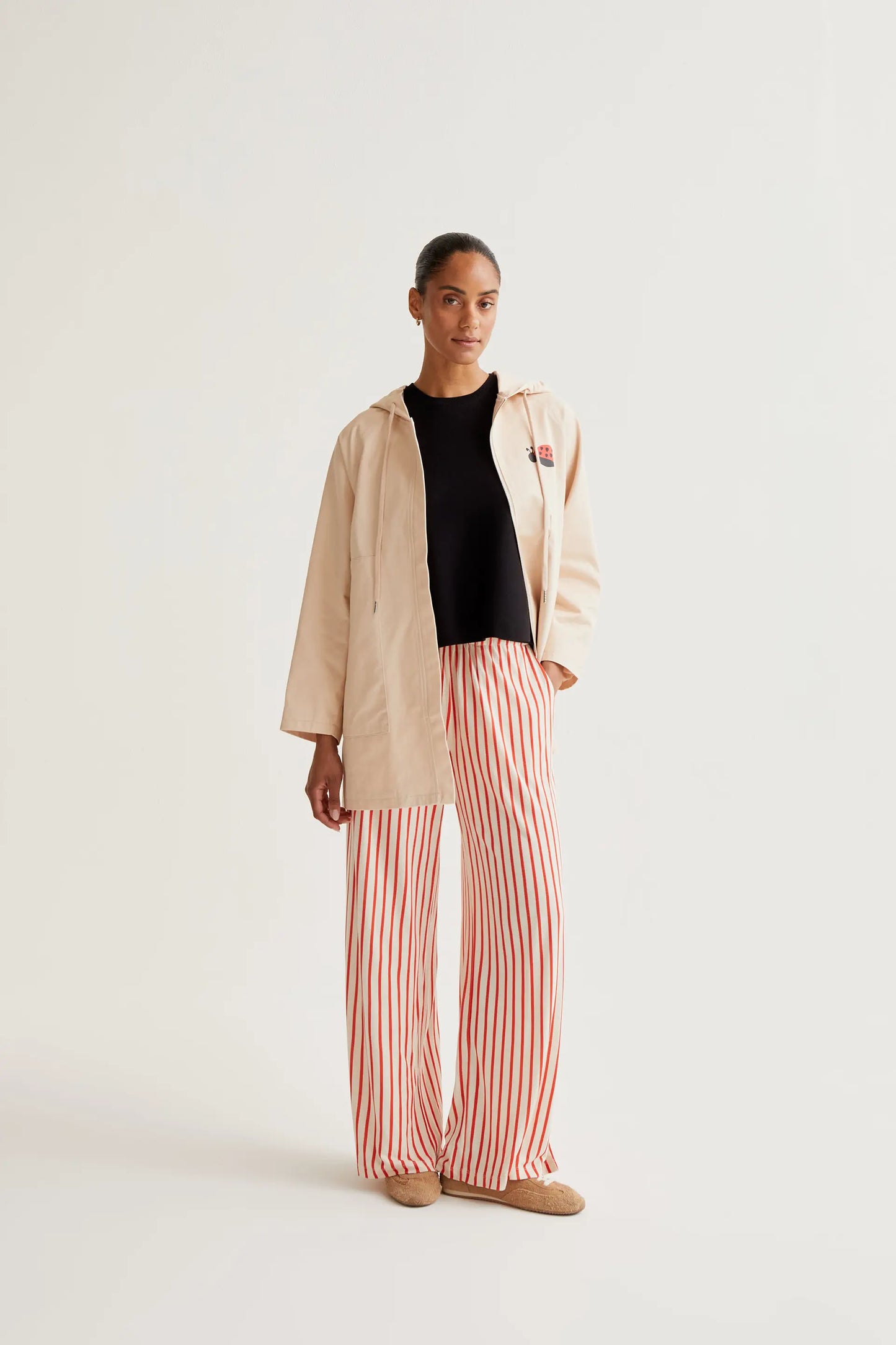 Trench coat with ladybug print