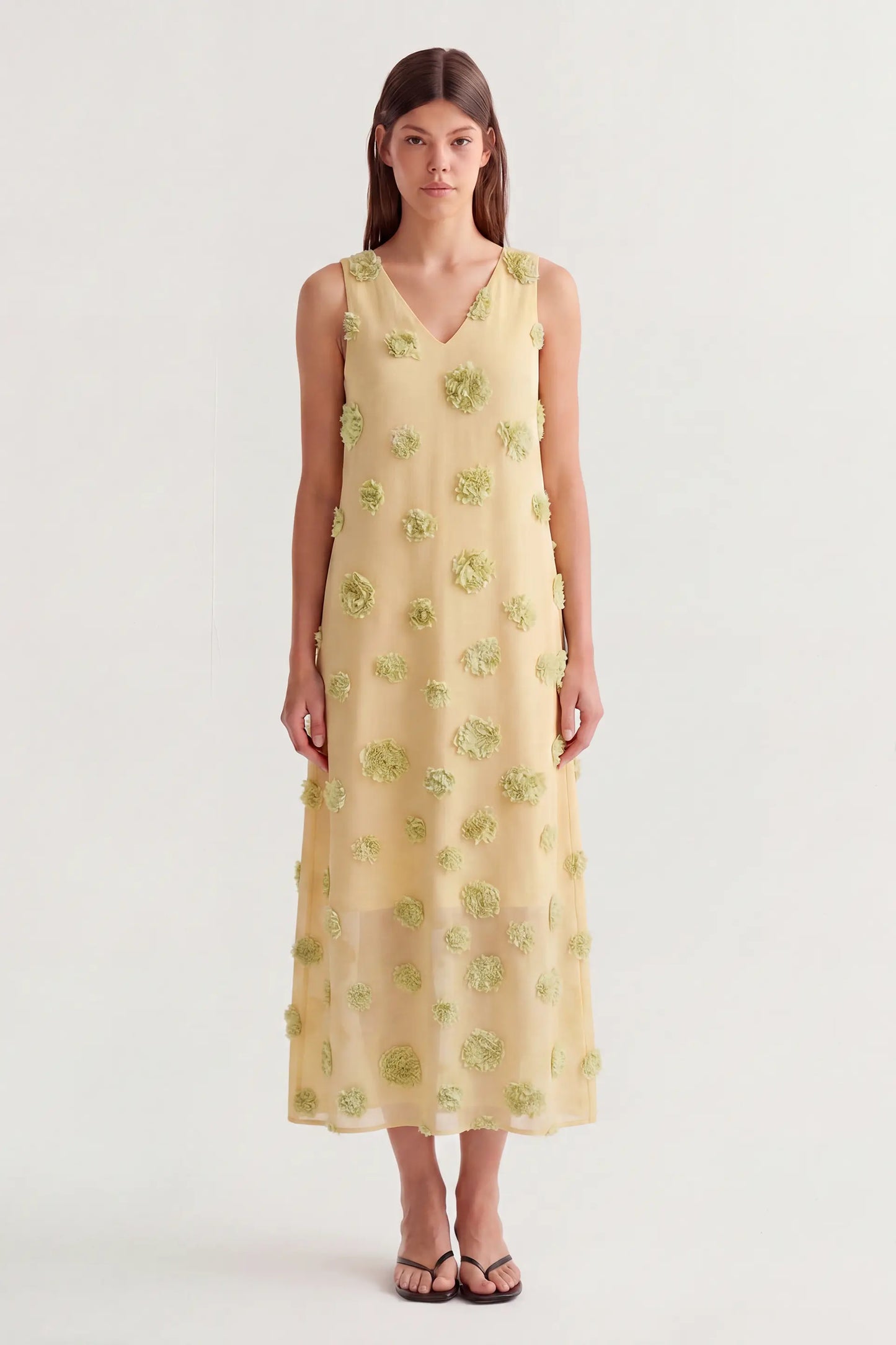 Vestito lungo giallo con dettaglio floreale