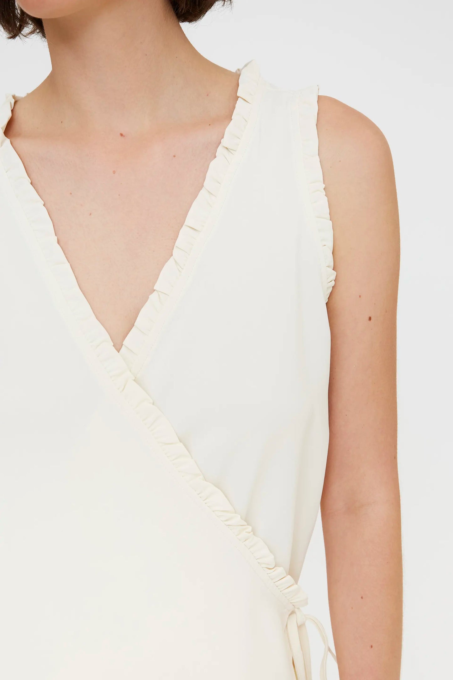 Off-white top with a V-neck