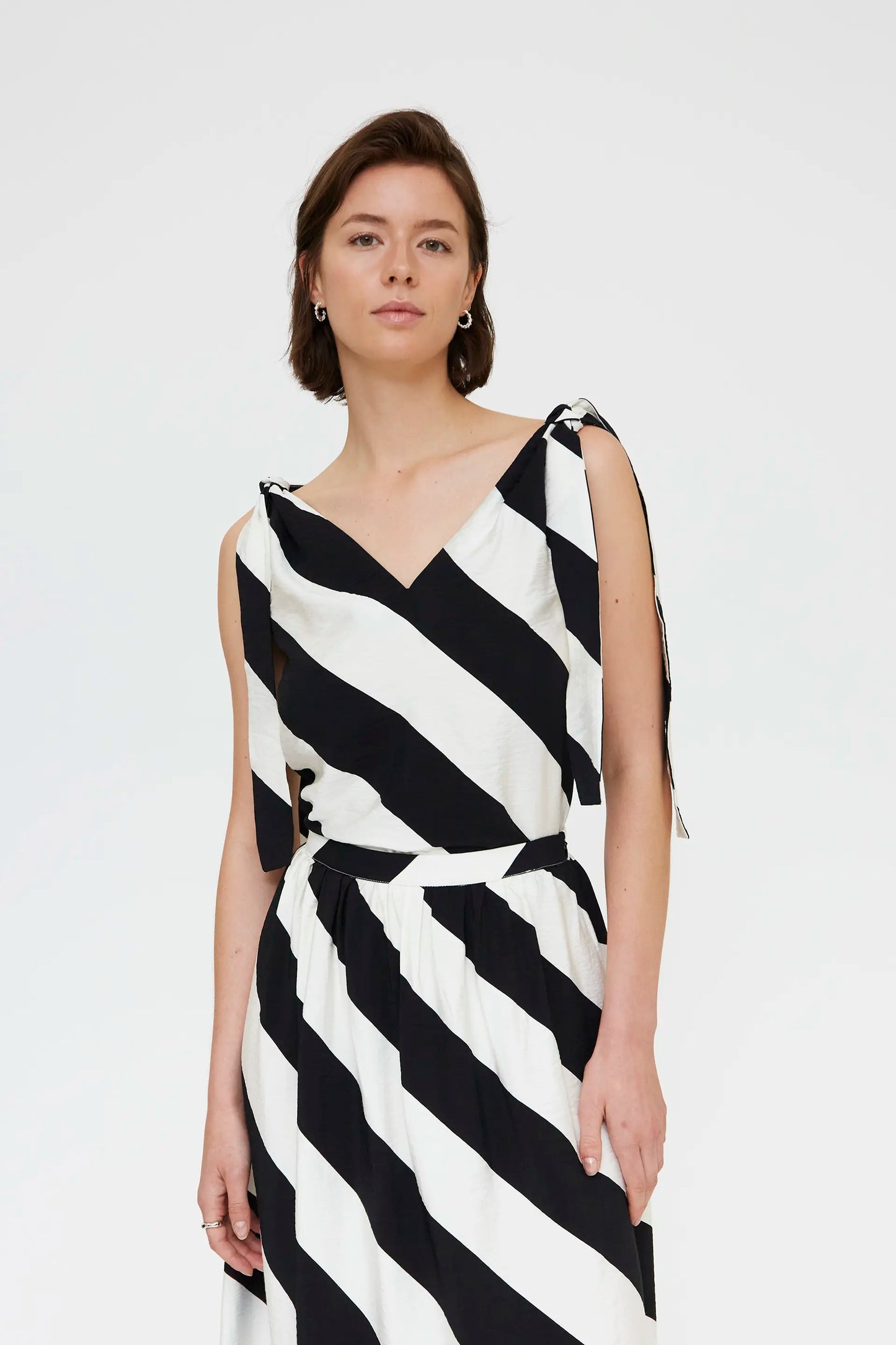 Top with diagonal striped print in black and white