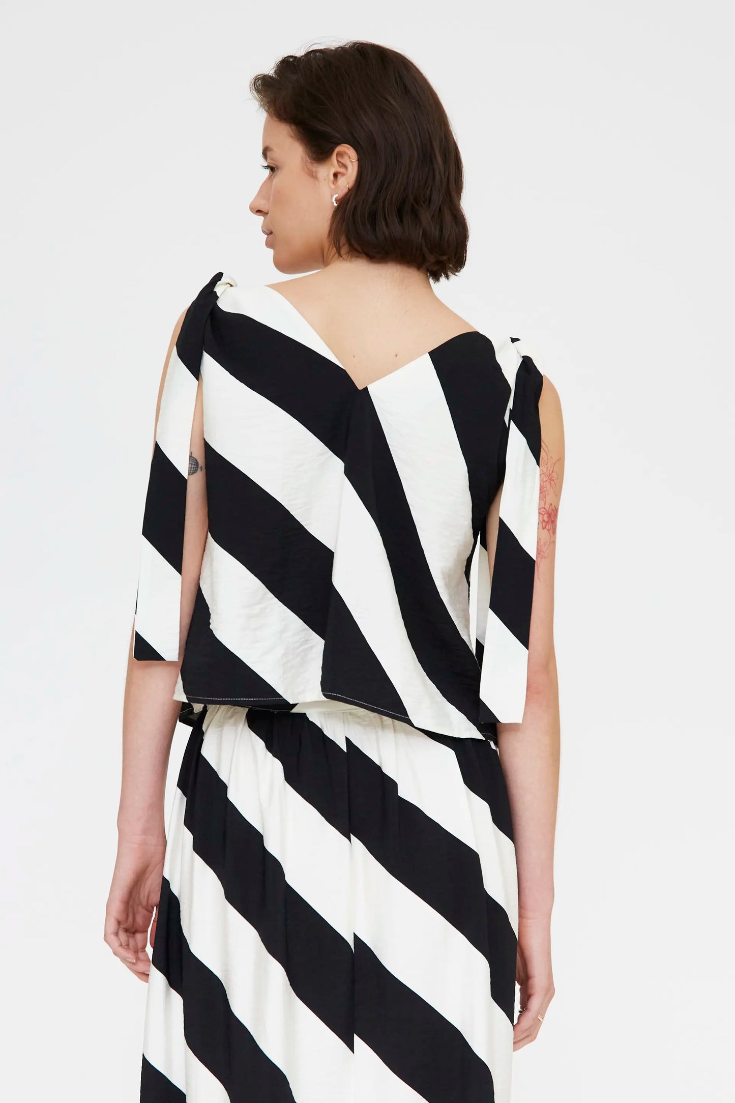 Top with diagonal striped print in black and white