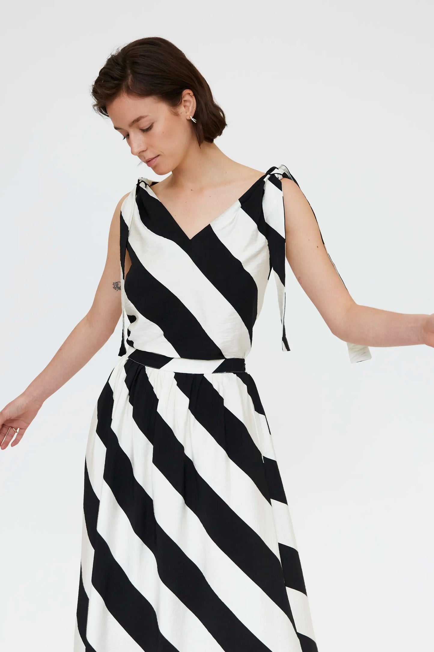 Top with diagonal striped print in black and white